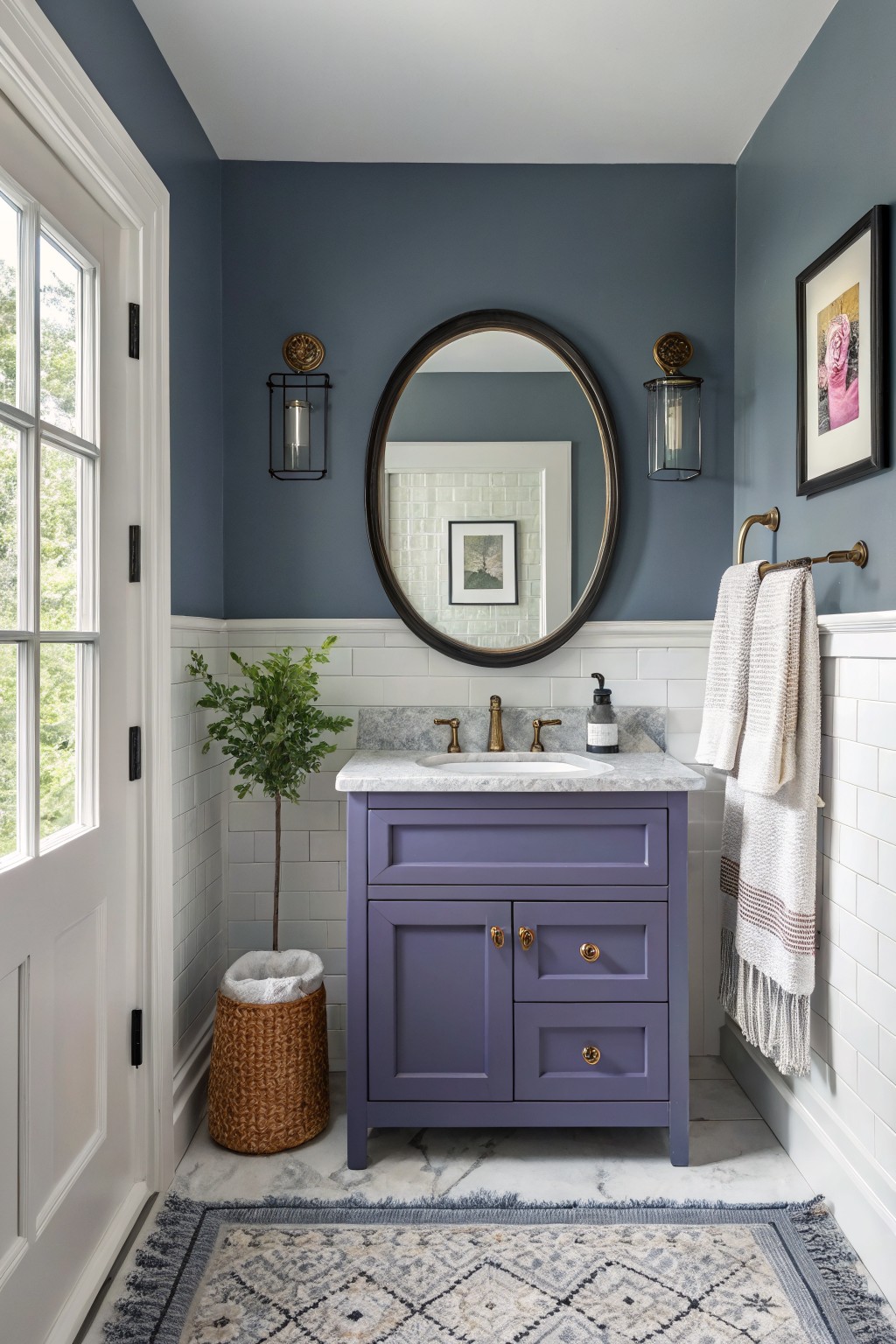 Cozy powder room with deep blue-gray walls, purple vanity, round mirror, white subway tile wainscot, and light gray floor