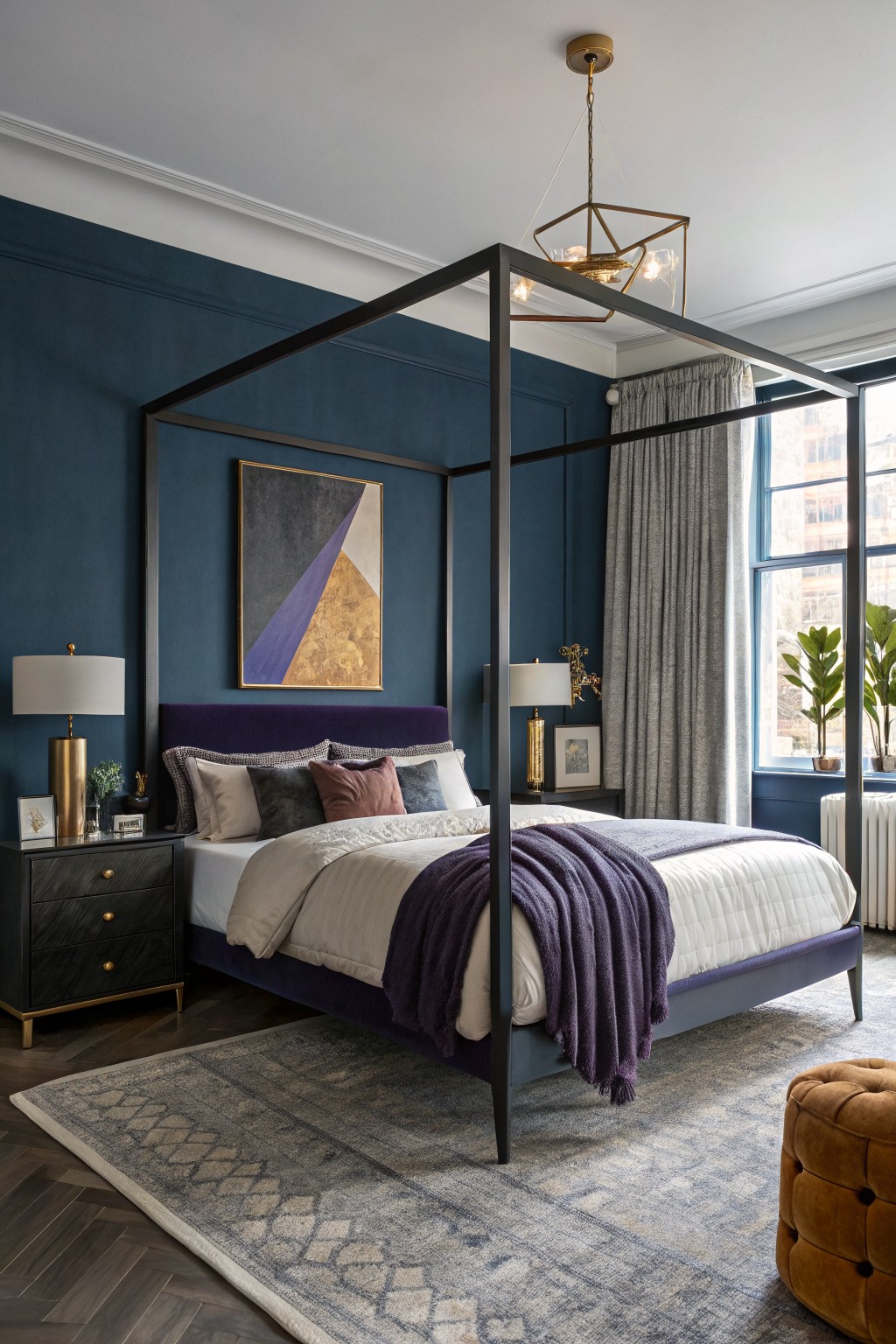 Bedroom featuring deep navy walls, black four-poster bed with purple throw, gold lamps, and gray rug on wood floors
