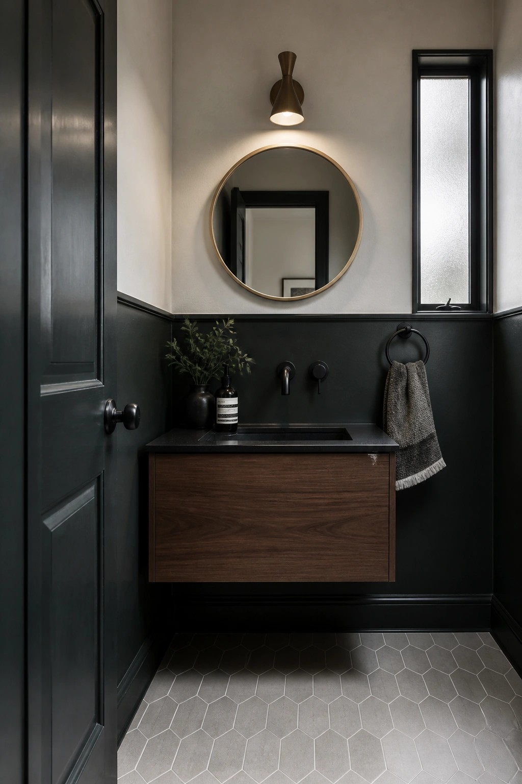 A bathroom featuring deep charcoal walls below a light upper section with a floating wood vanity.