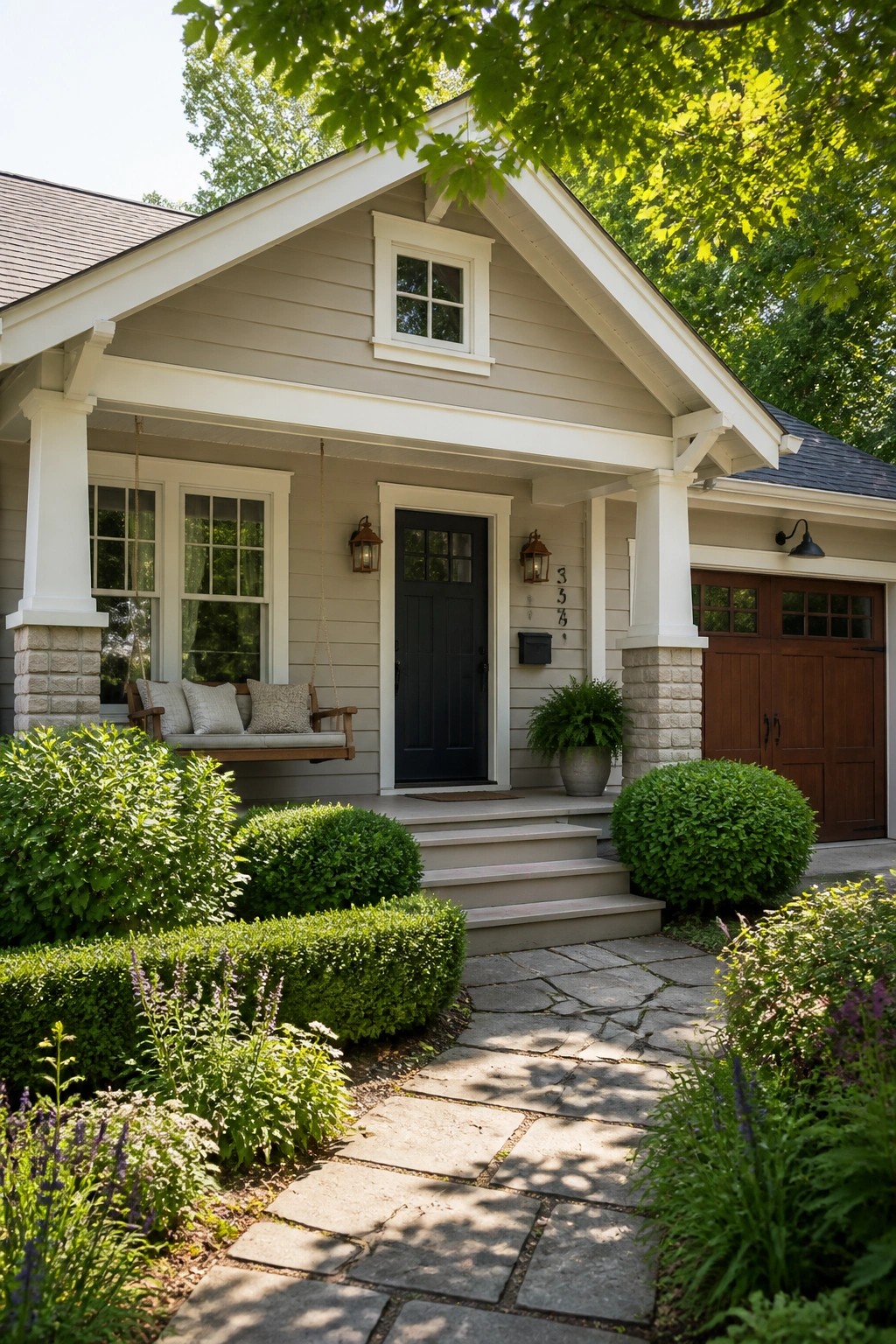 A house exterior painted in light greige siding with white trim and a stone path.