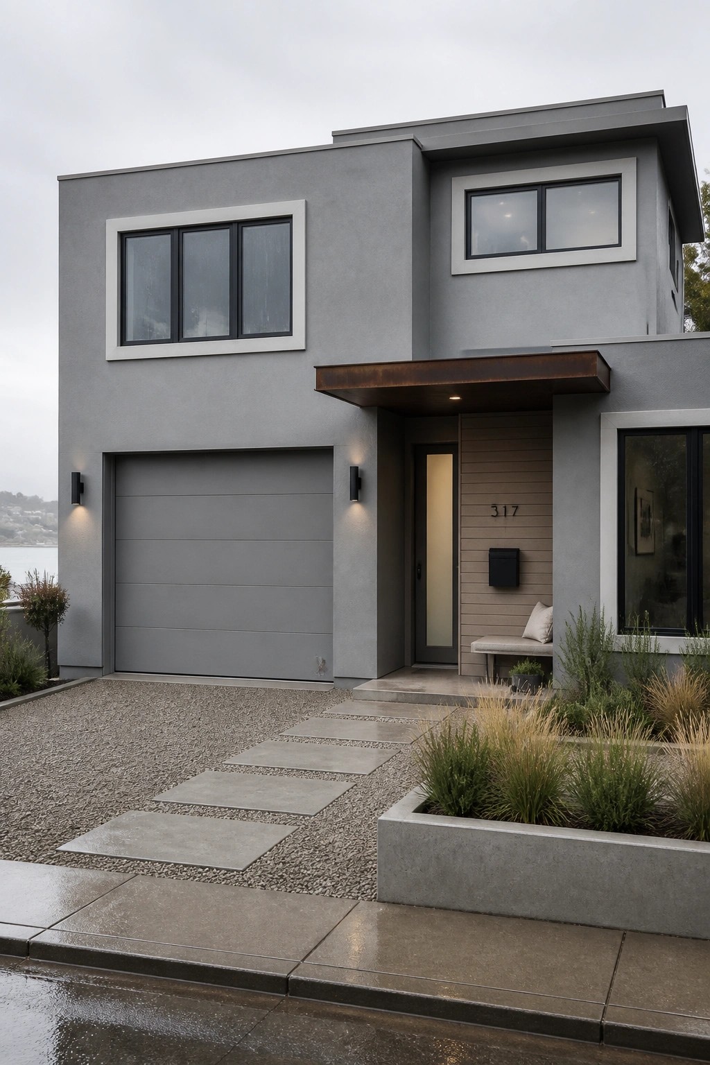 Modern house exterior finished in a soft gray paint color.