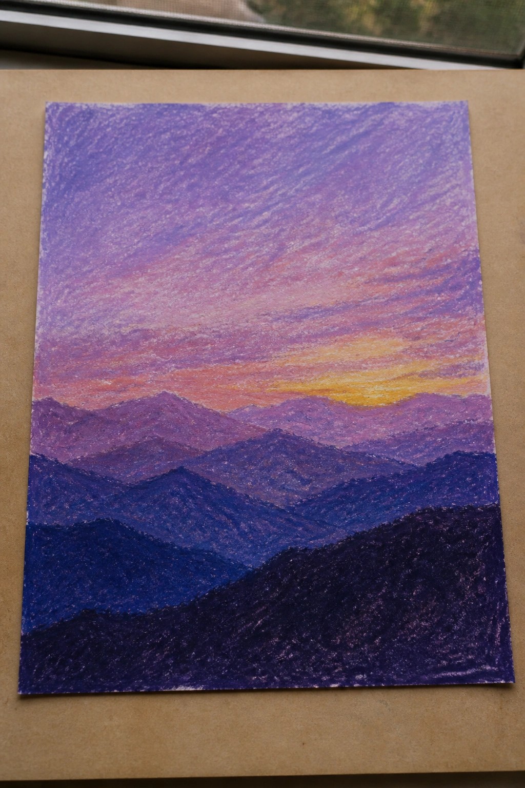 Layered purple mountains under a vibrant pink-orange-yellow sunset sky in textured pastels
