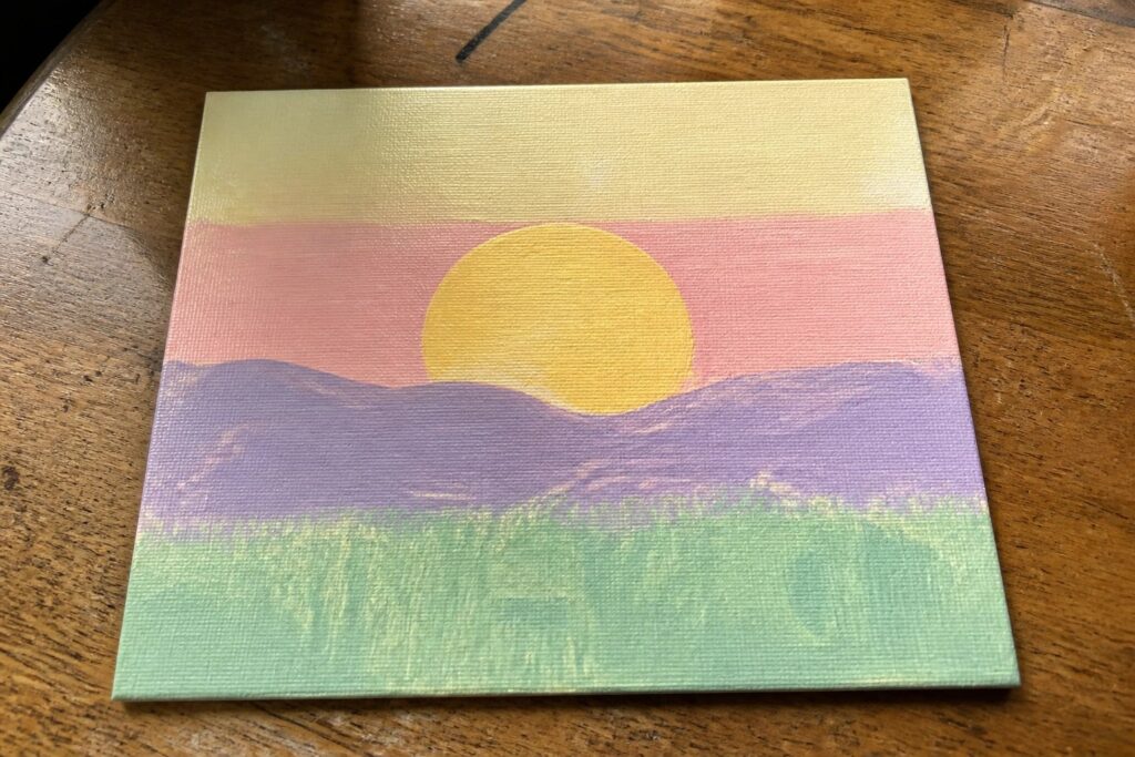 Vibrant sunset painting with yellow sun over layered pink, purple, and green hills.