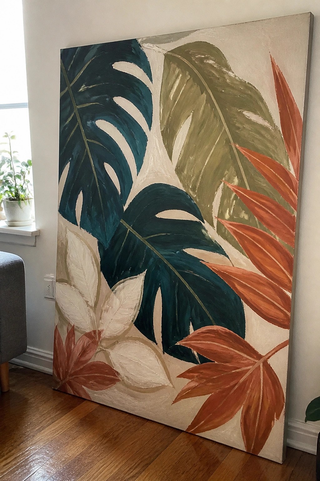 Large abstract painting of vibrant tropical leaves in teal, green, and orange.