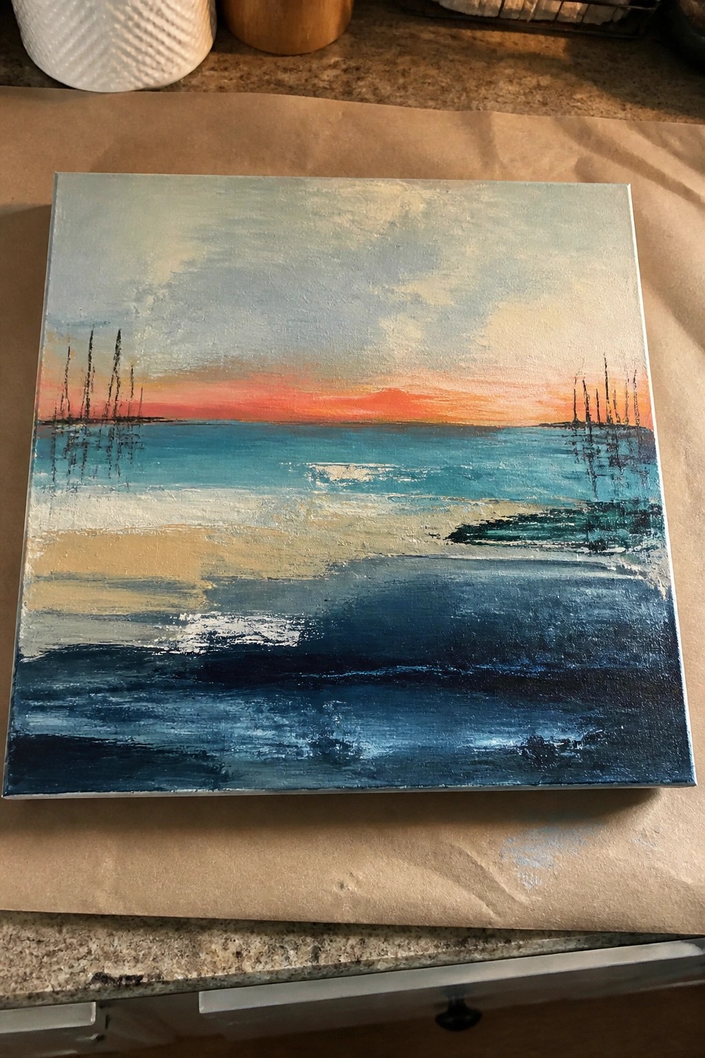 Abstract seascape painting on canvas with blue ocean, orange sunset sky, and dark poles.