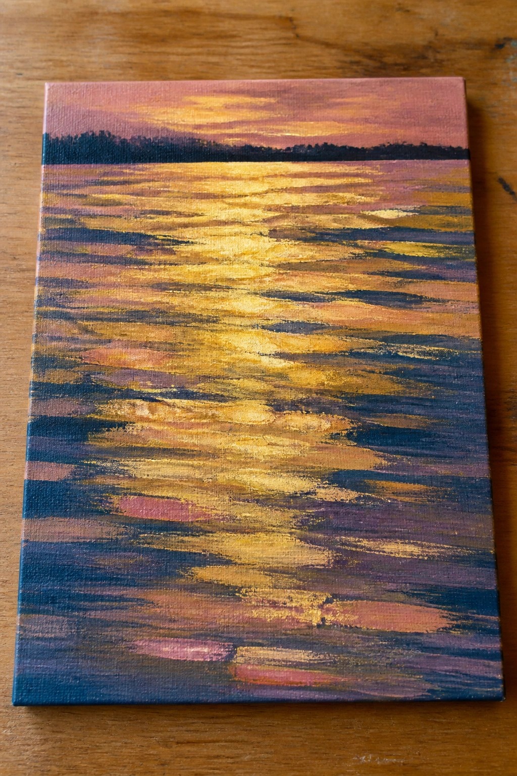 Sunset painting with golden reflections on layered colorful waves beneath pink-orange sky