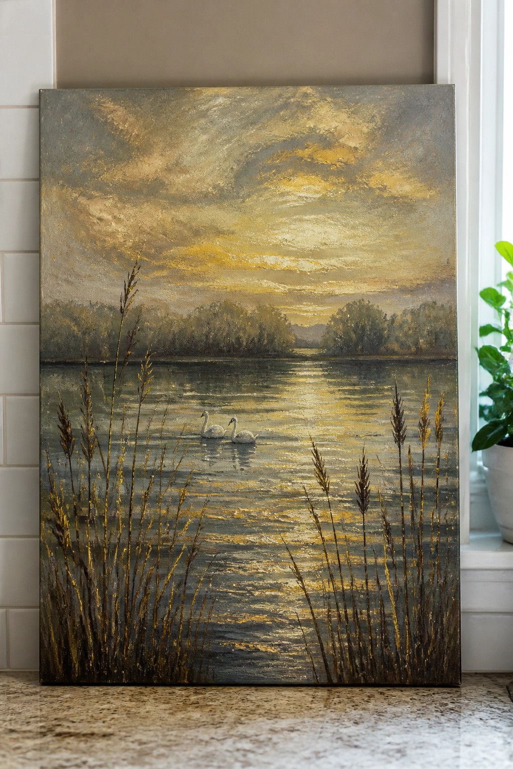 Two swans on a golden lake at sunset with tall reeds in foreground.