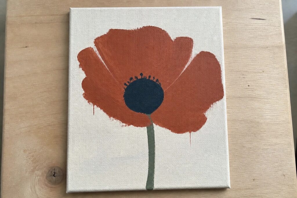18 Modern Flower Painting Ideas in Minimalist Floral Styles Abstract orange-red poppy with dark center, green stem, and paint drips on white canvas