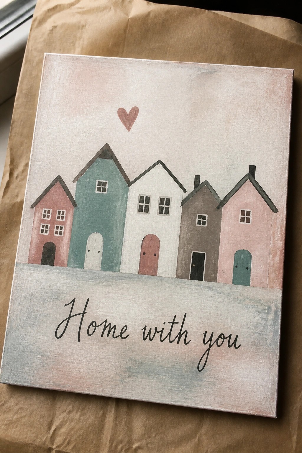 A canvas shows five pastel houses in a row with a small heart above them and the words 