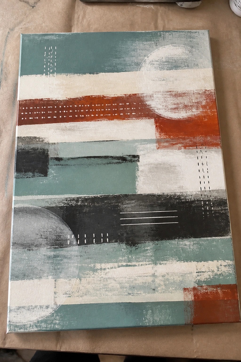 Abstract canvas with teal, orange, black, and white stripes, circles, and dashed lines.
