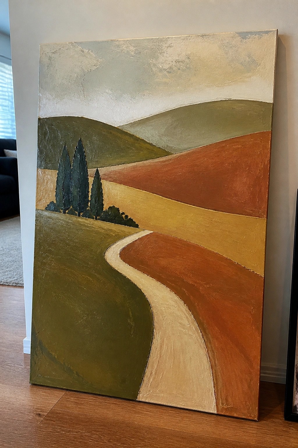 Oil painting of rolling hills in green, brown, and orange tones with a winding beige path and tall dark trees on the left.