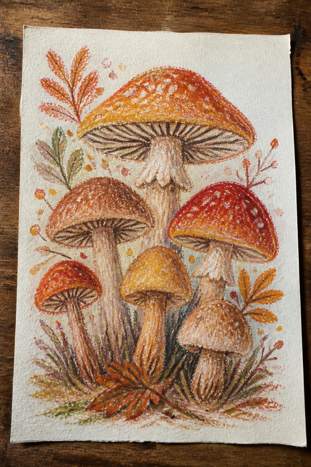Colorful mushroom drawing with red and orange caps amid autumn leaves and foliage
