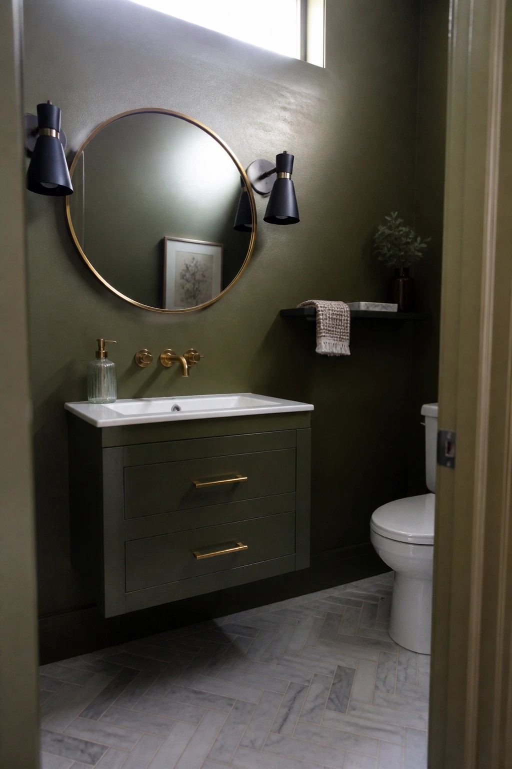 Deep olive green walls and matching vanity in a small bathroom with marble tile flooring.
