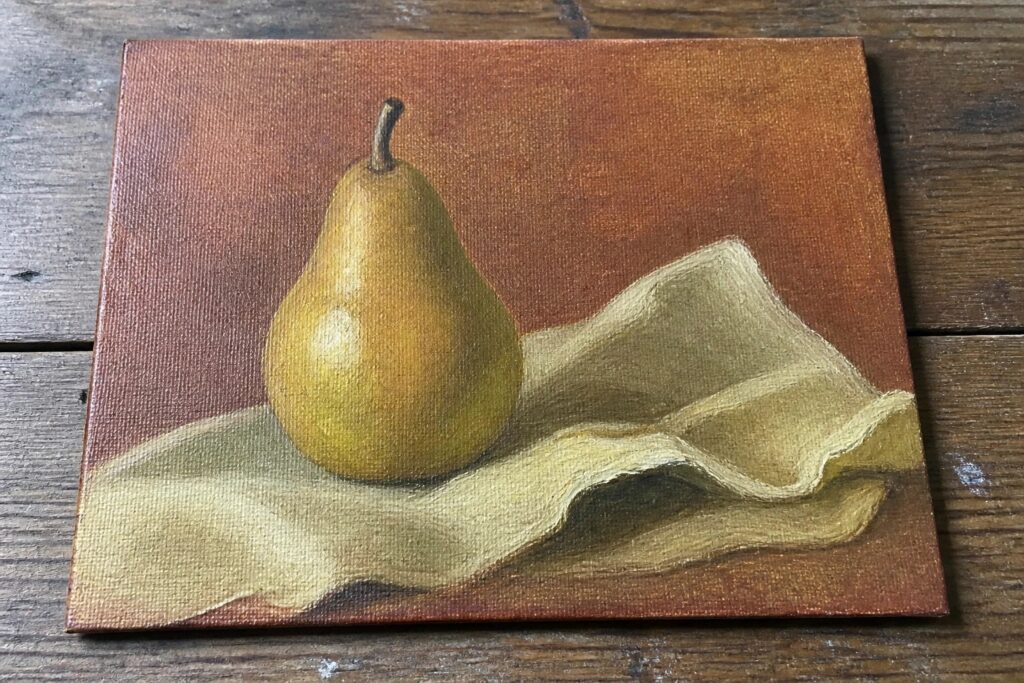 Still-life painting of green pear beside draped white cloth on brown canvas
