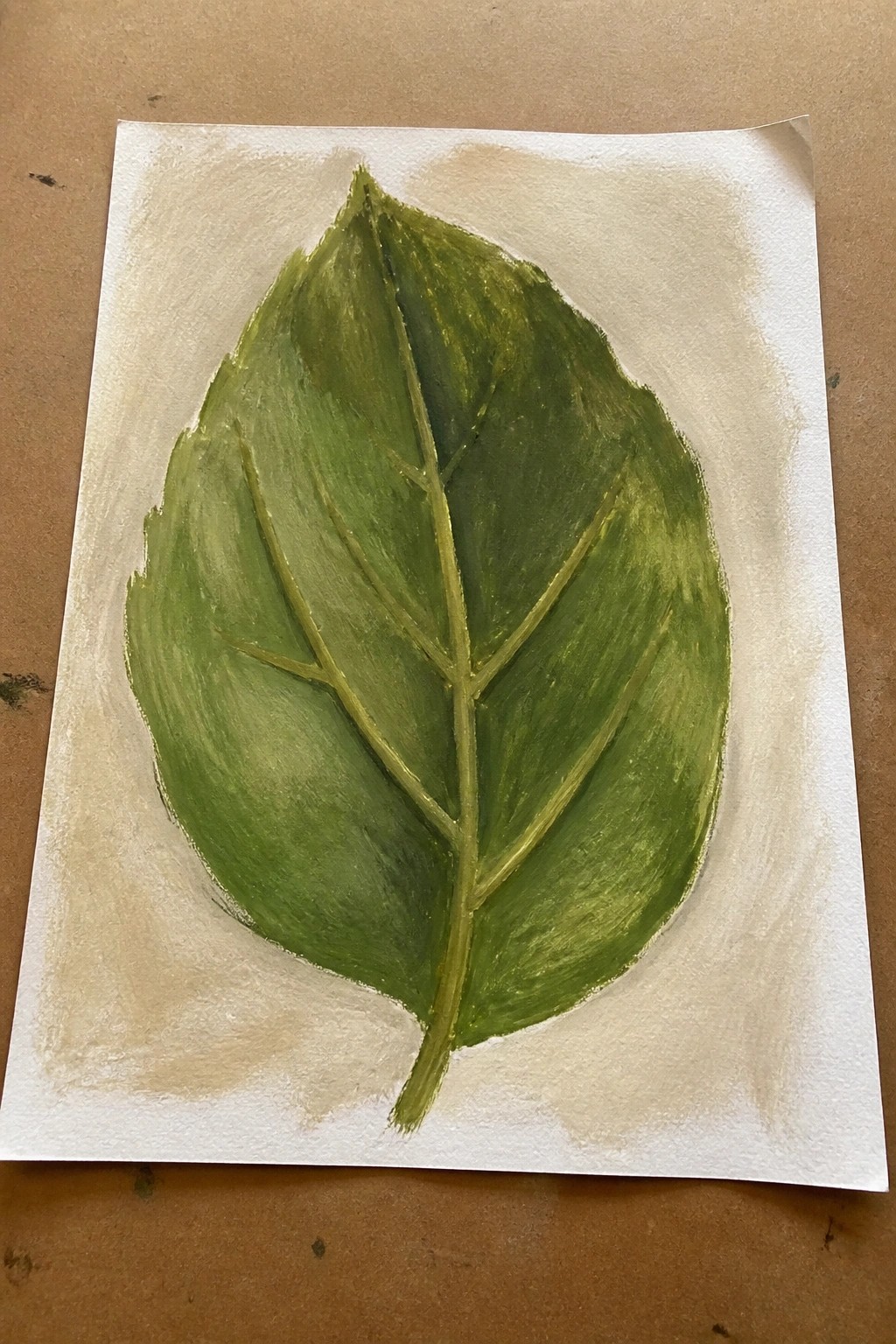 Green leaf painting with detailed veins and stem on white paper