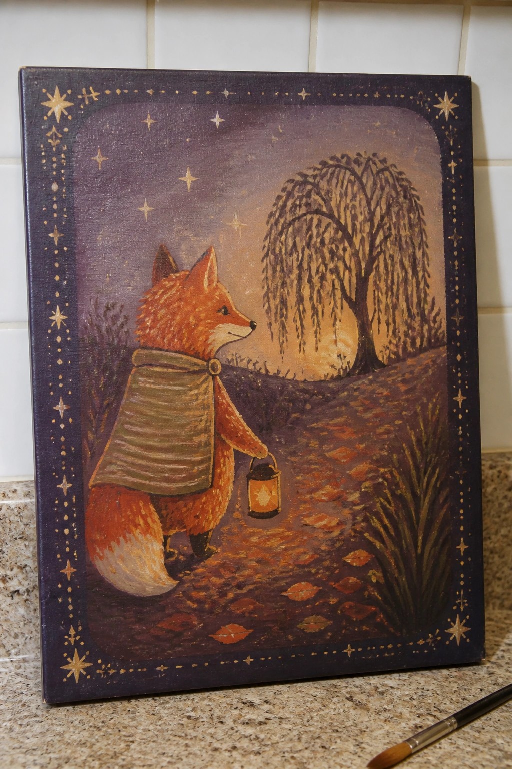 Orange fox in striped cloak holds lantern on leaf path by willow under starry border
