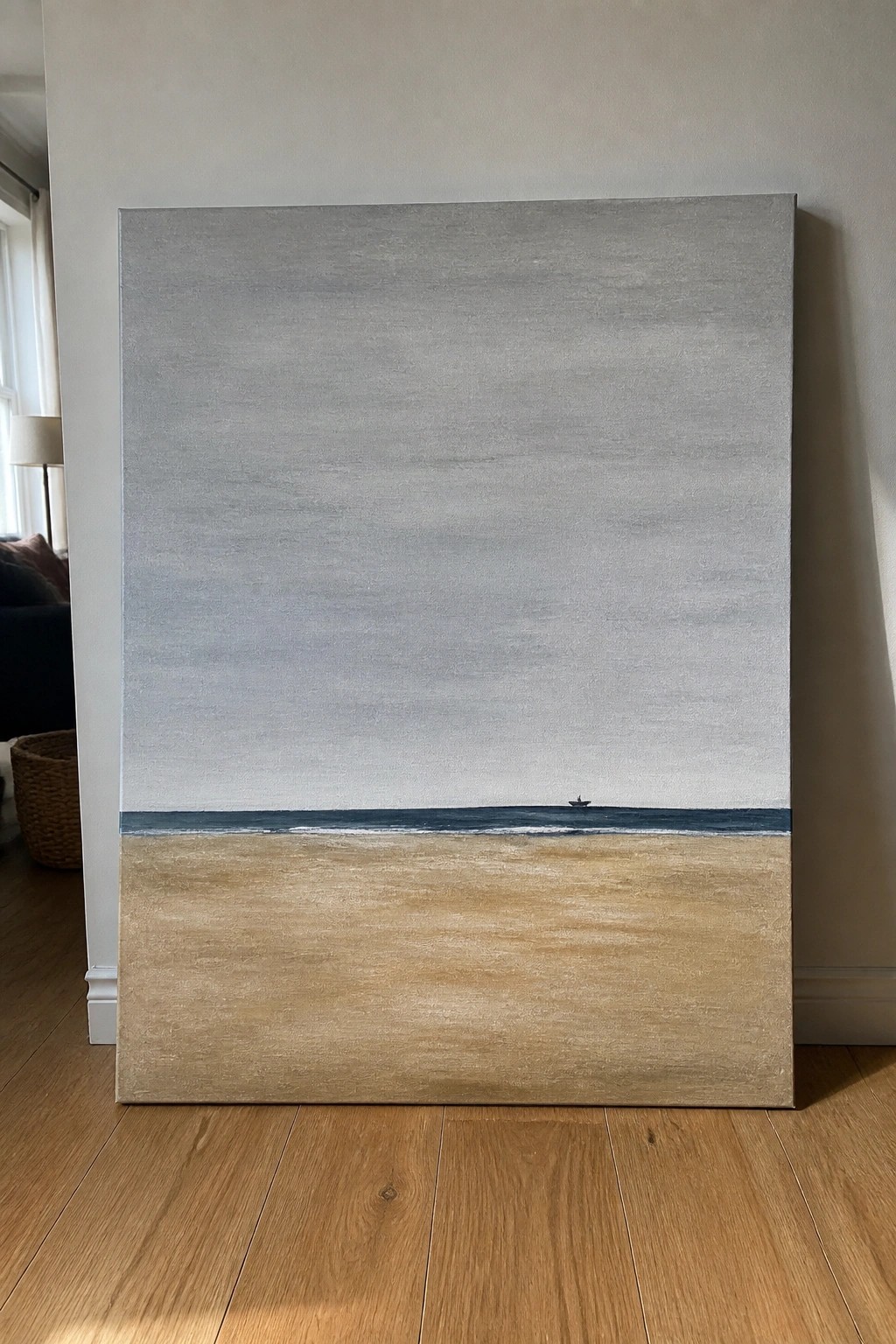 Minimalist painting of gray sky, blue sea with boat, and sandy beach on floor