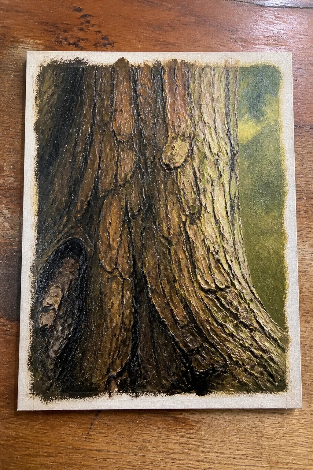 Textured painting of a tree trunk with rough brown and green bark on canvas