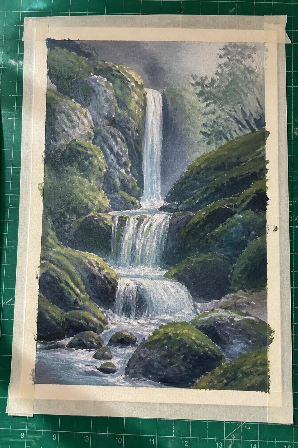Painting of cascading waterfall amid mossy green rocks and cliffs on mat.