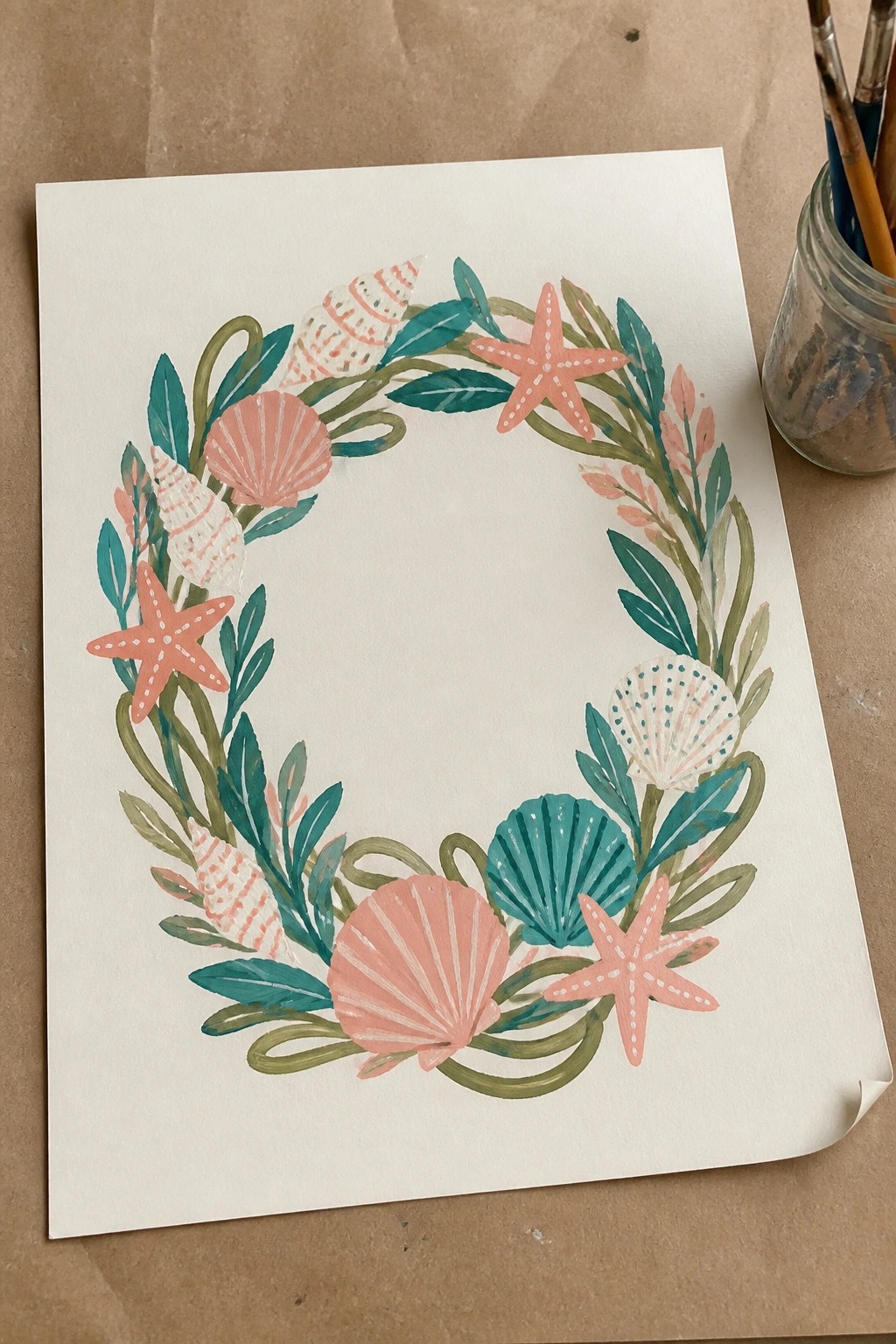 Watercolor seashell and starfish wreath in coral, teal, and green on white paper