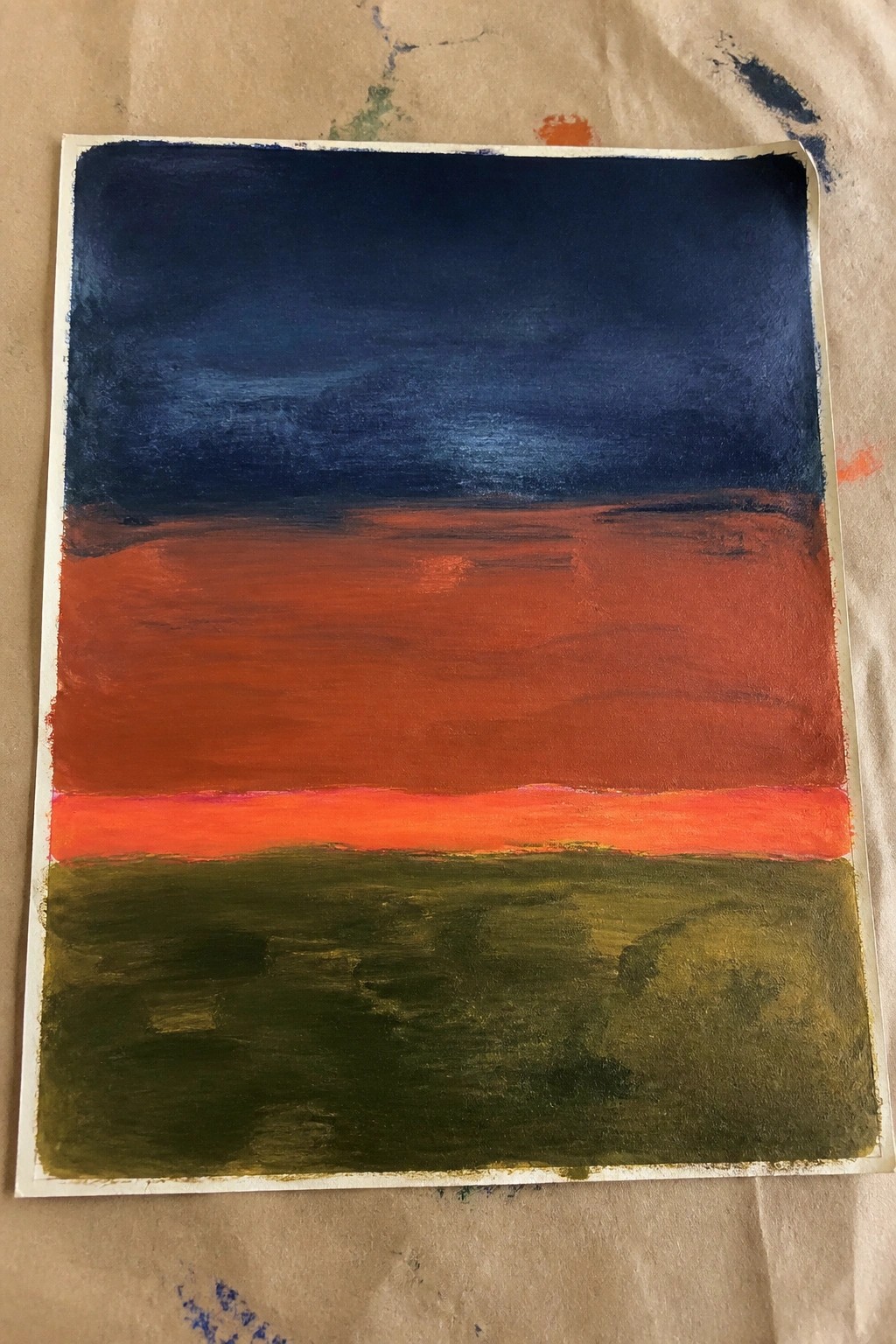 Abstract painting with dark blue top over red middle and green bottom bands.
