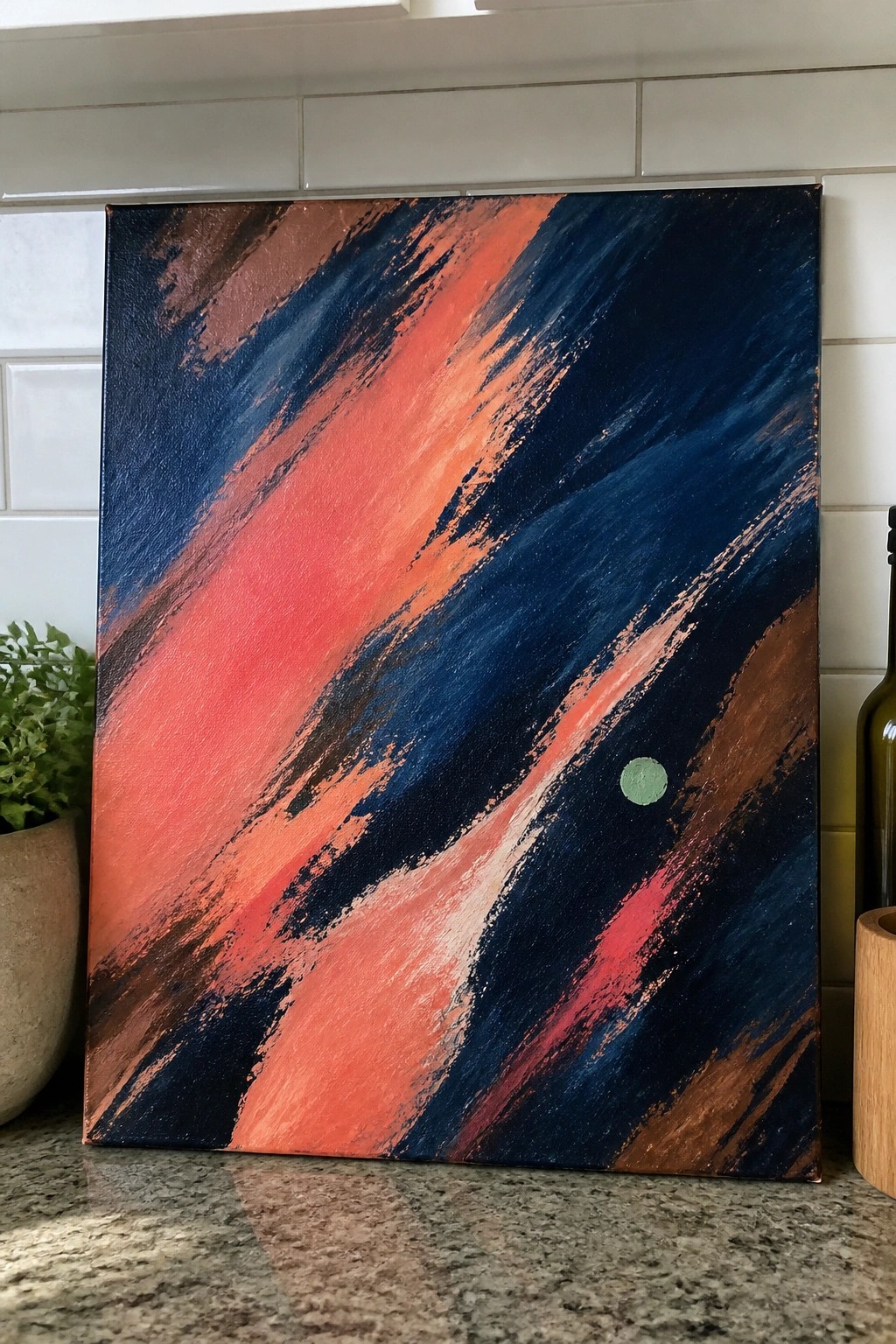 Abstract painting with vibrant coral blue brown brushstrokes and small green dot on canvas