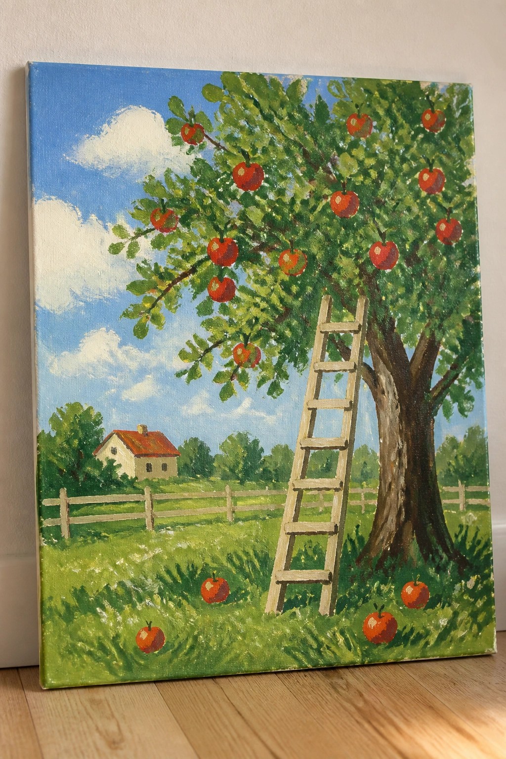 Vibrant painting of apple tree with ladder, red apples, house, and blue sky