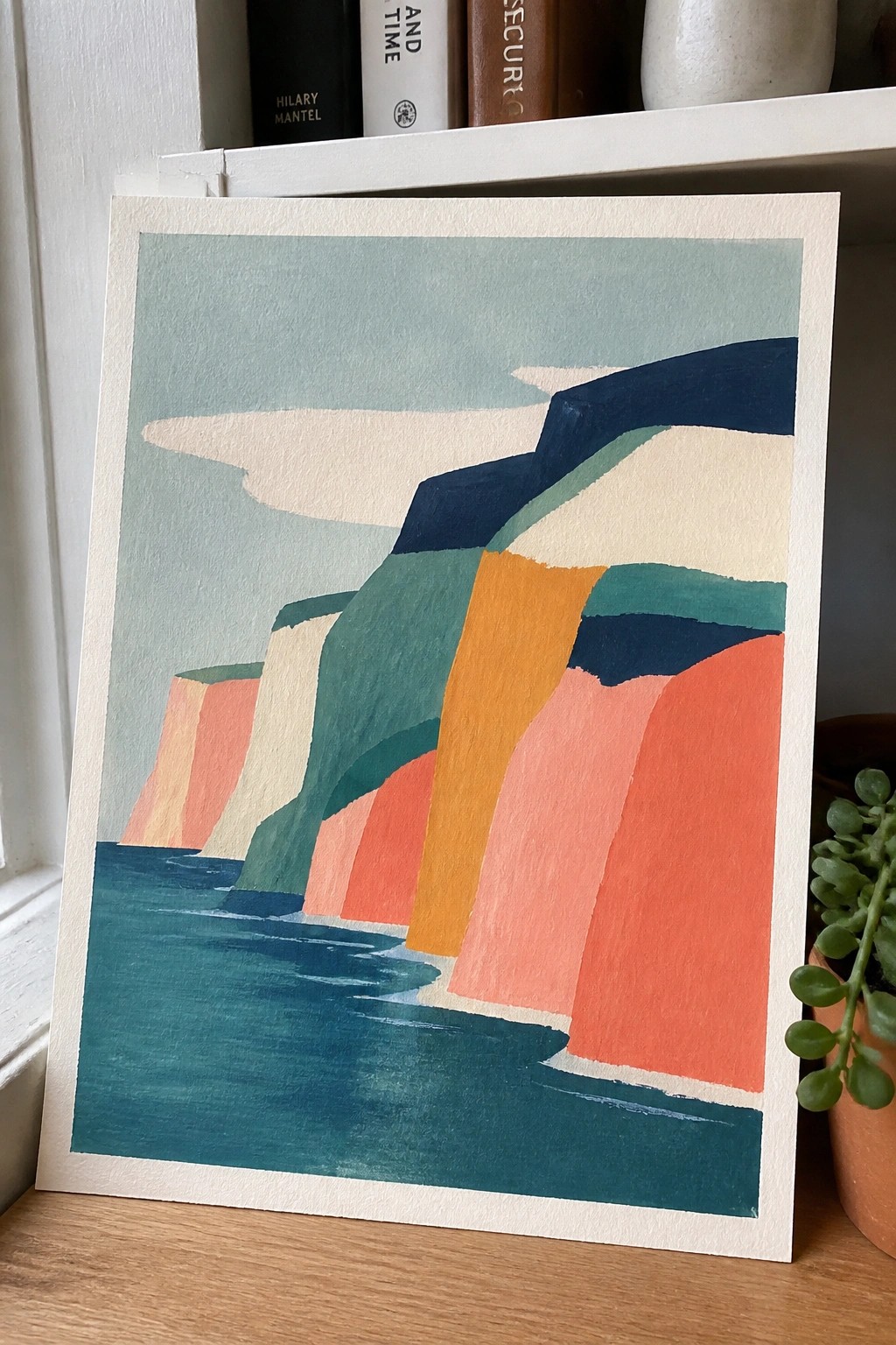 Abstract painting of layered colorful cliffs by teal sea under pale sky.