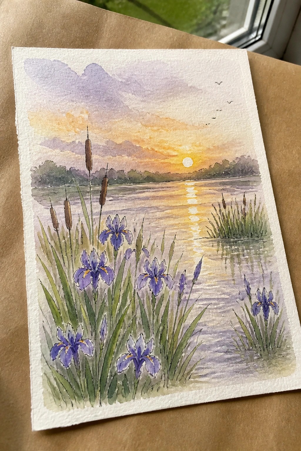 Watercolor sunset over lake with purple irises, cattails, birds, and golden reflections