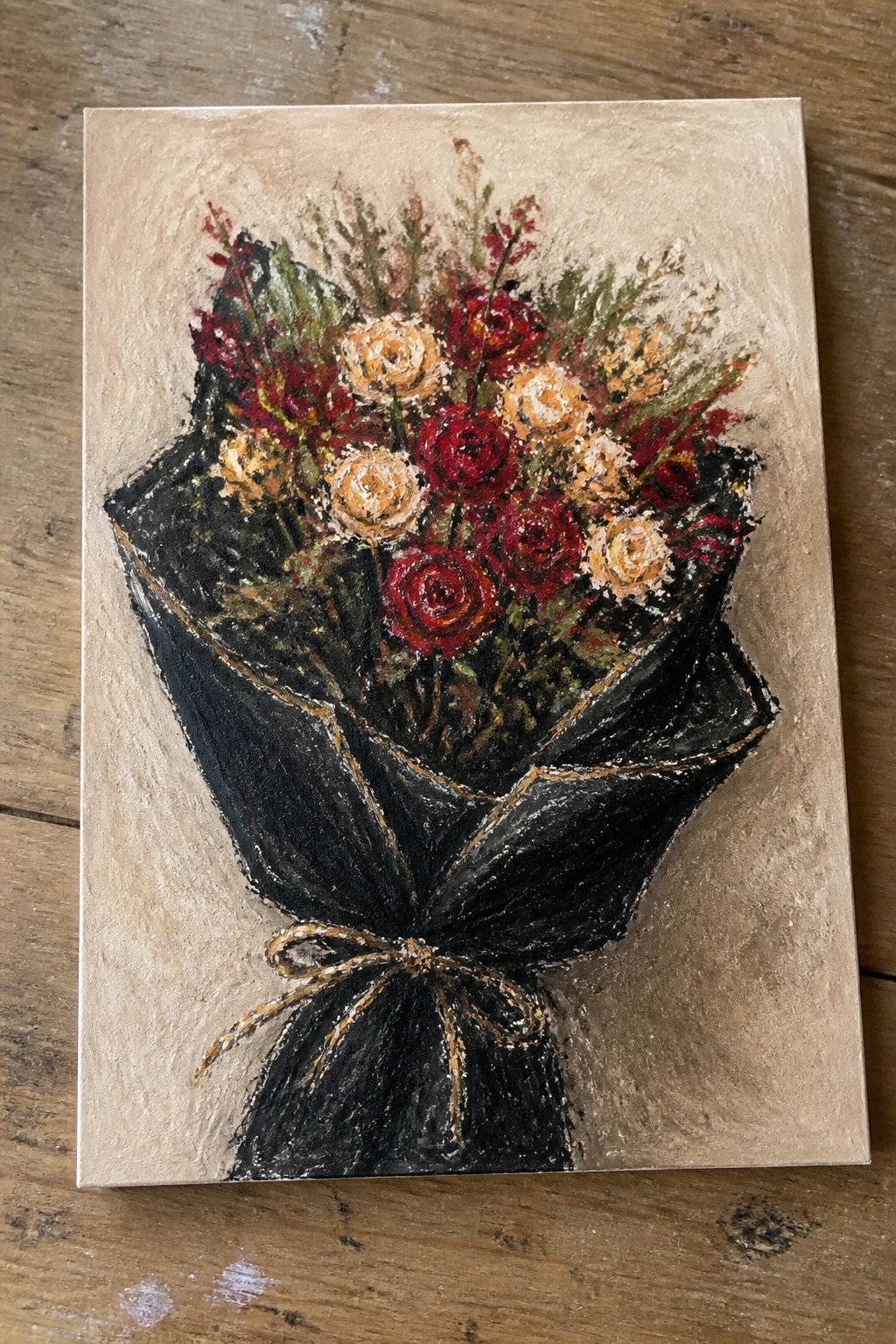 Textured painting of red and peach roses wrapped in black paper with gold bow.