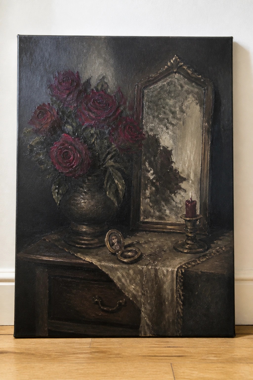 Dark still life with red roses in vase, mirror, candle, and open locket.