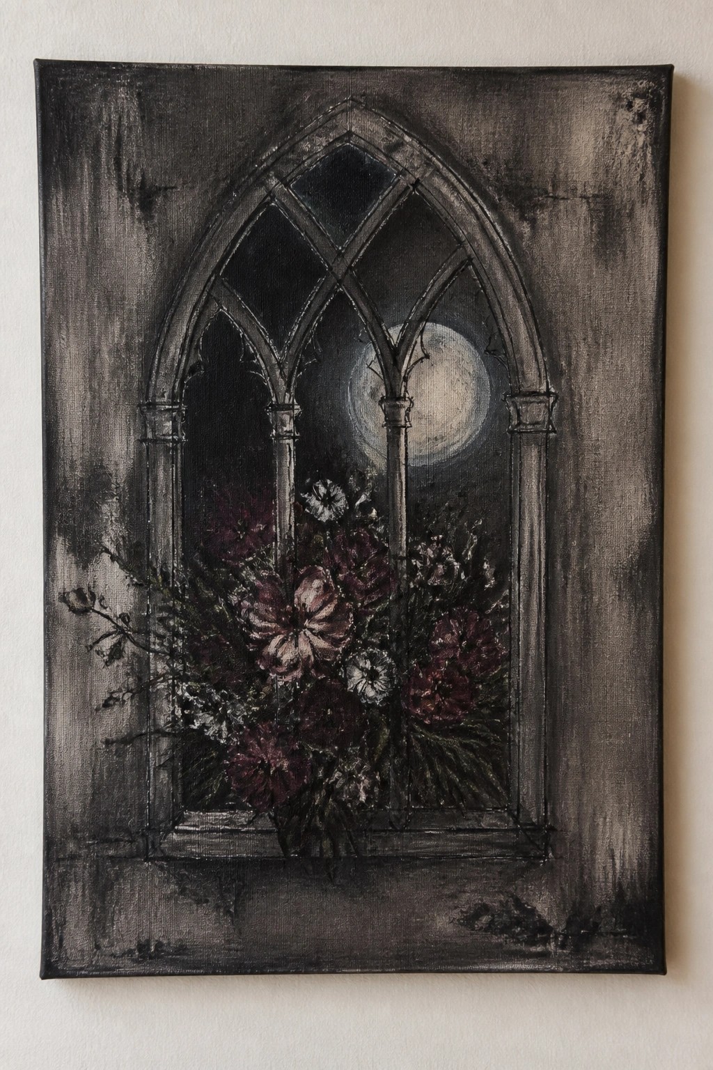 Gothic arched window with full moon and dark purple-red flowers at sill.
