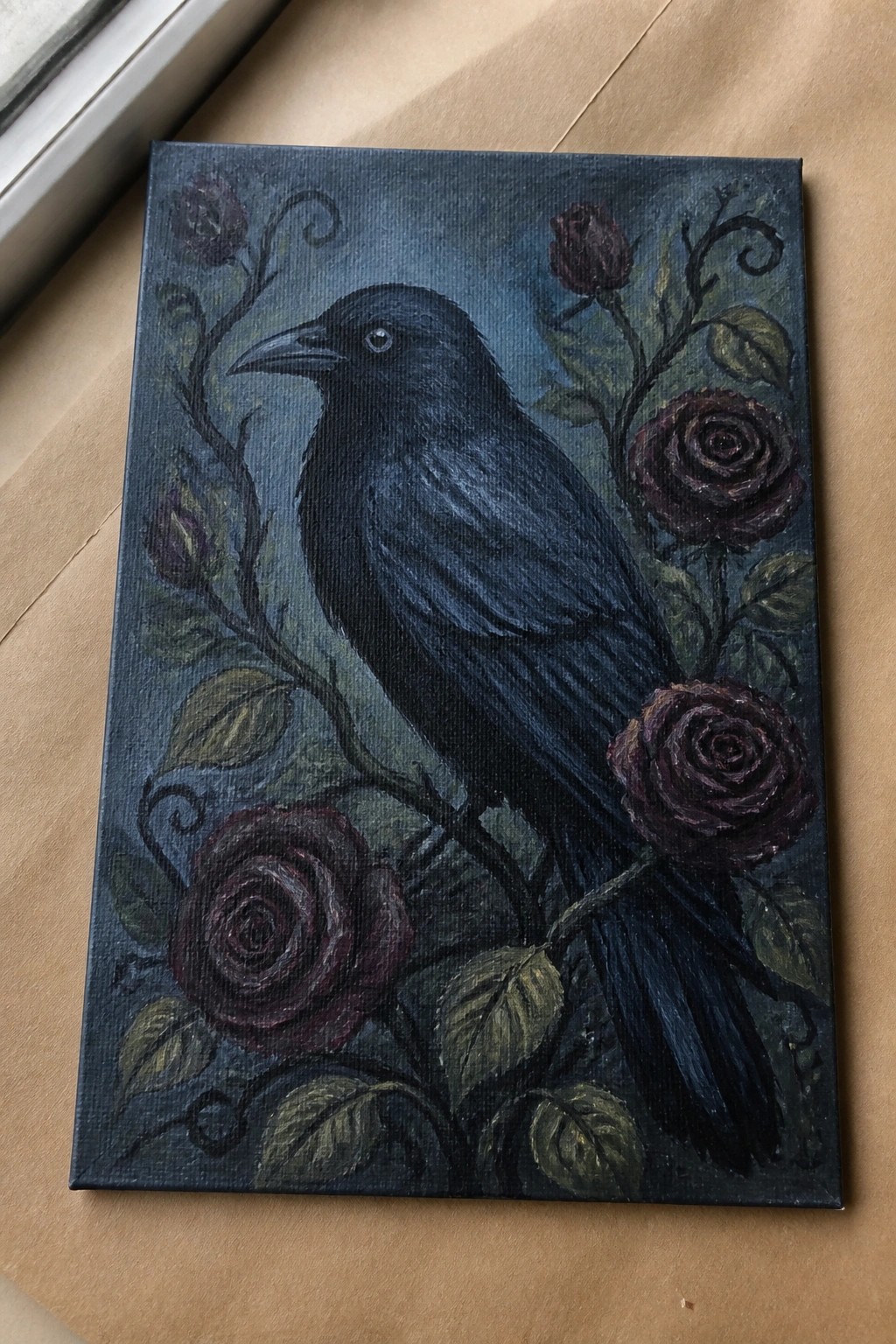 Black raven perched amid dark red roses on leafy vines in moody painting