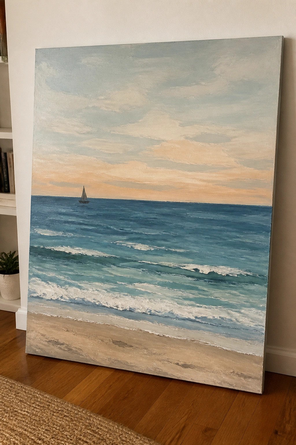 Canvas painting of blue ocean waves on sandy beach under orange sunset sky with distant sailboat