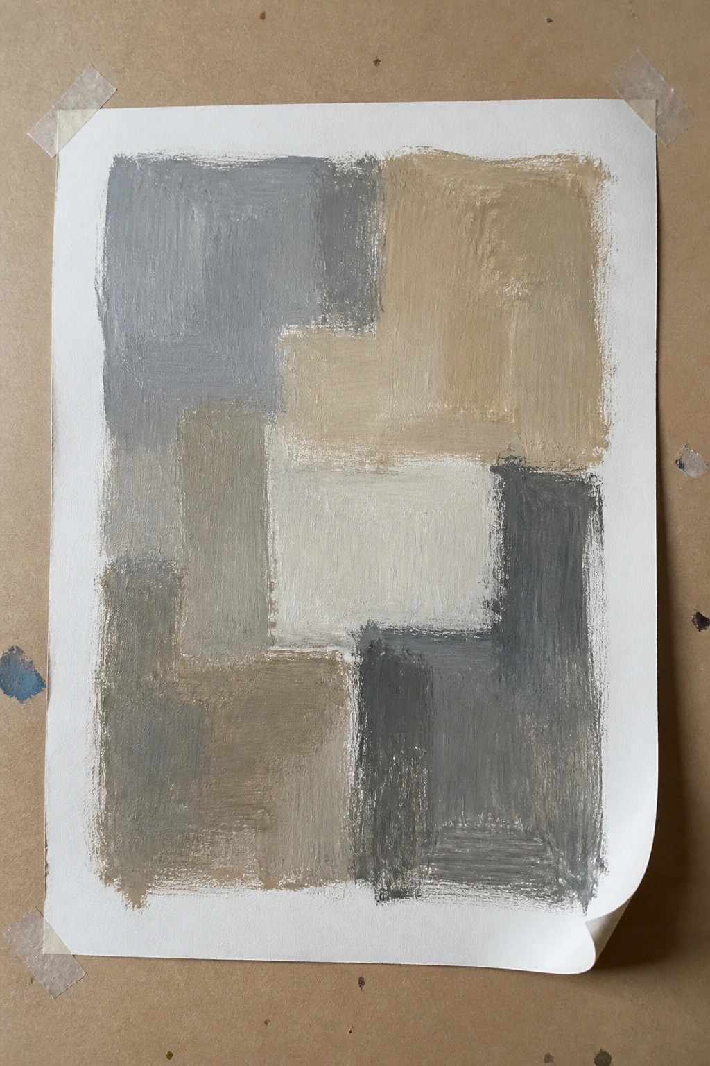 Abstract painting of overlapping gray, beige, and white rectangular shapes on paper