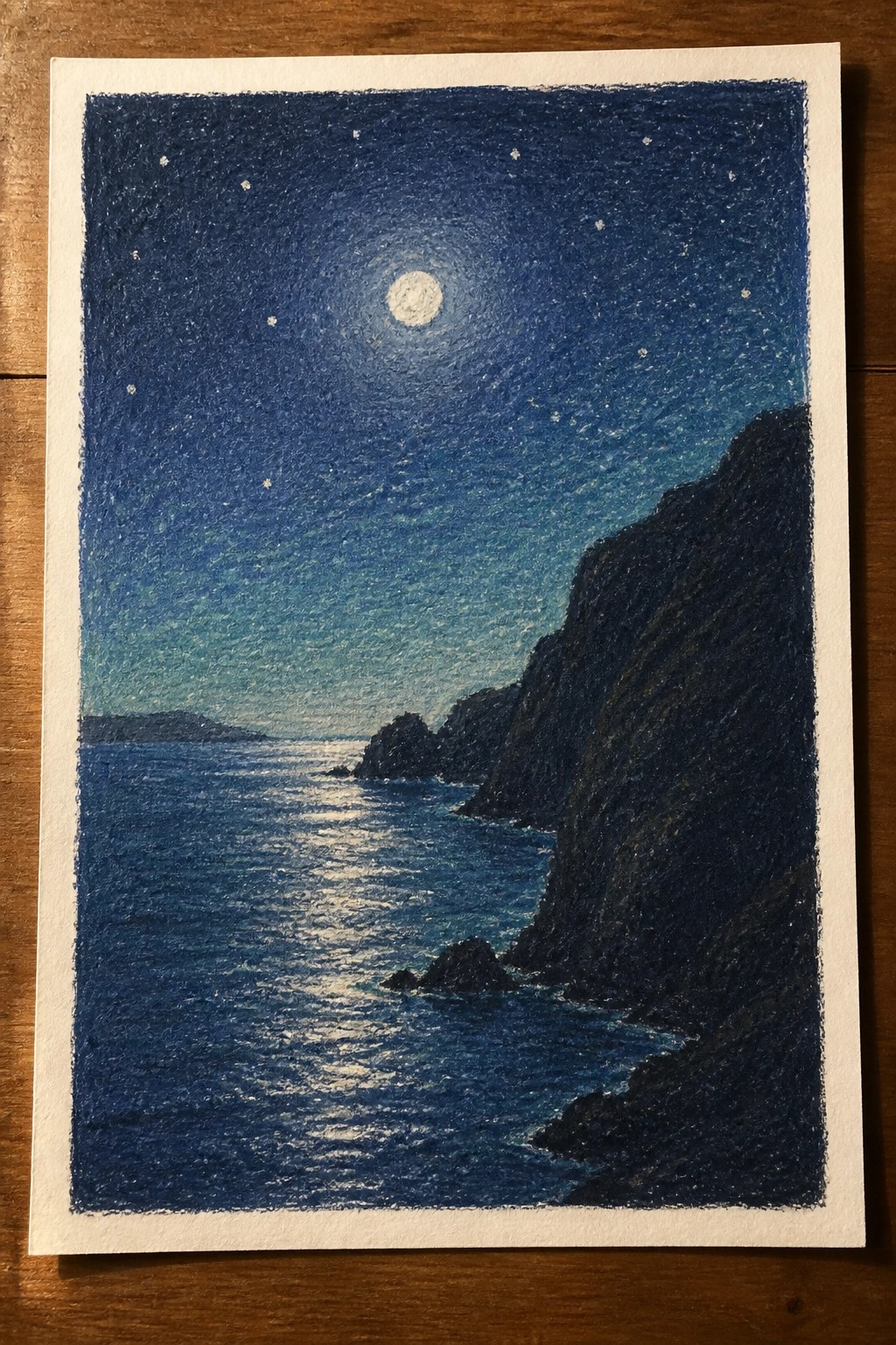 Moonlit ocean with starry sky and dark rocky cliffs in textured blue tones.