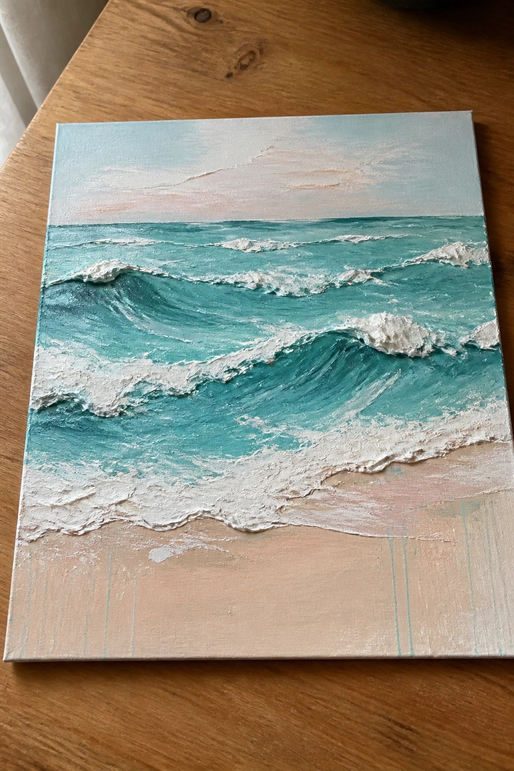 Textured painting of turquoise ocean waves crashing onto a sandy beach under a pastel sky.