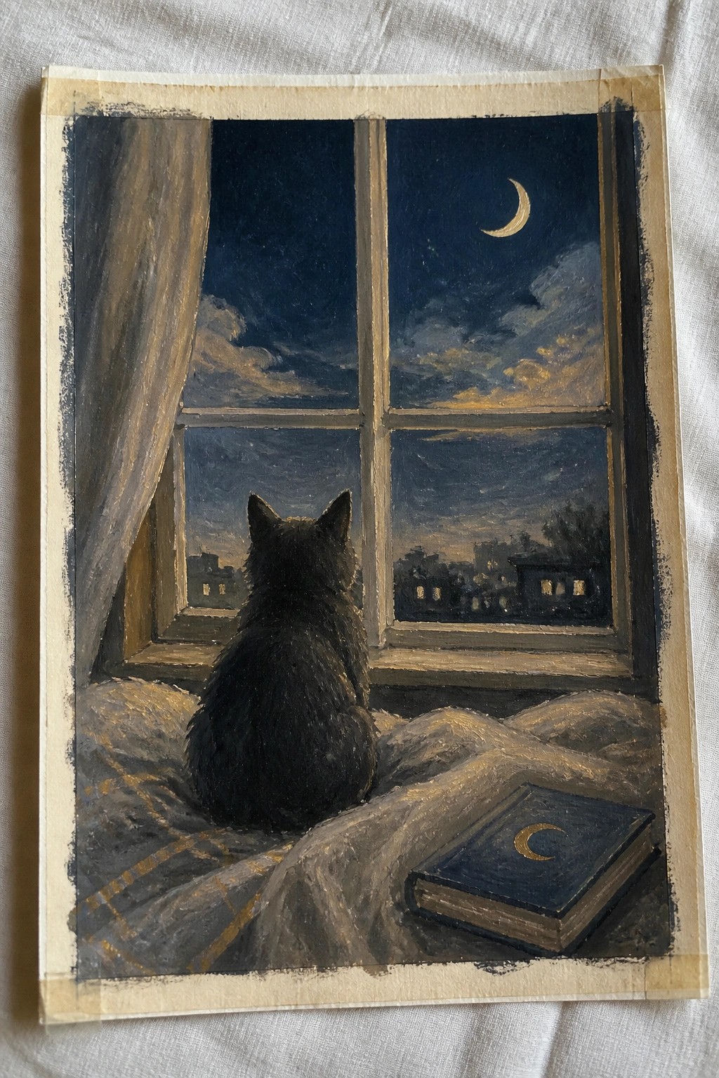 Black cat on bed gazes through window at crescent moon over city with book nearby