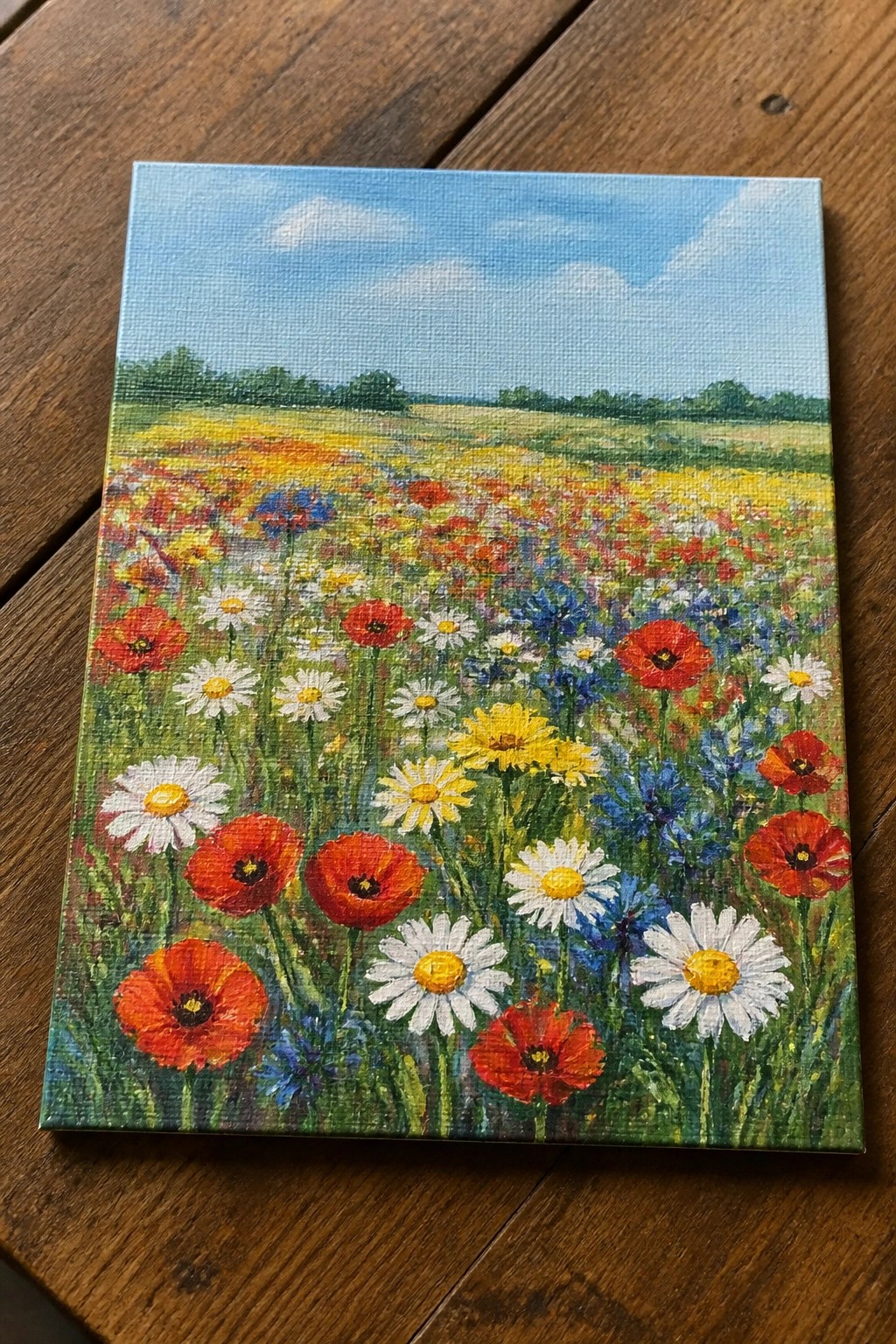 Vibrant wildflower meadow painting with red poppies, white daisies on canvas over wood
