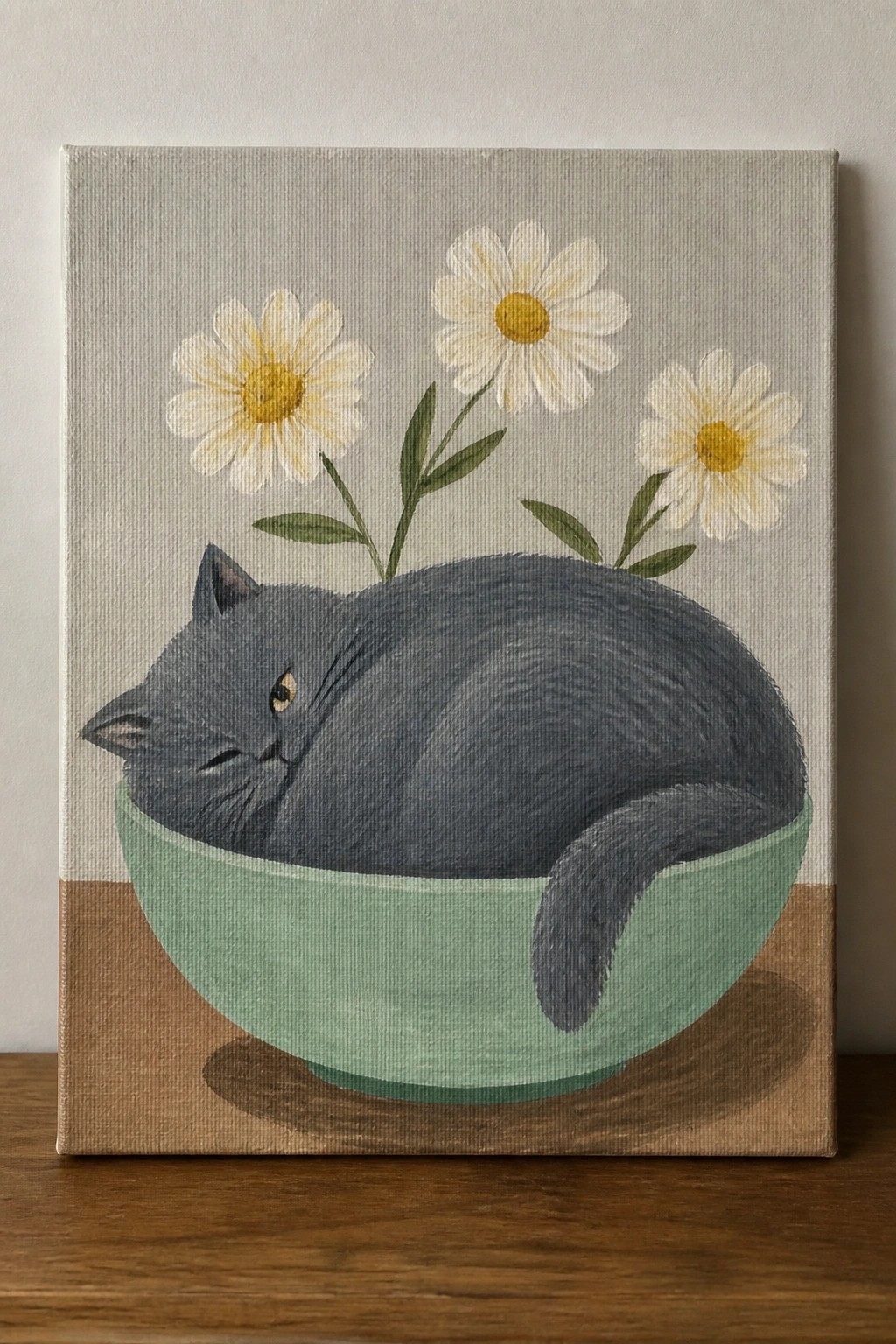 Gray cat curled in green bowl with white daisies, painted on canvas.
