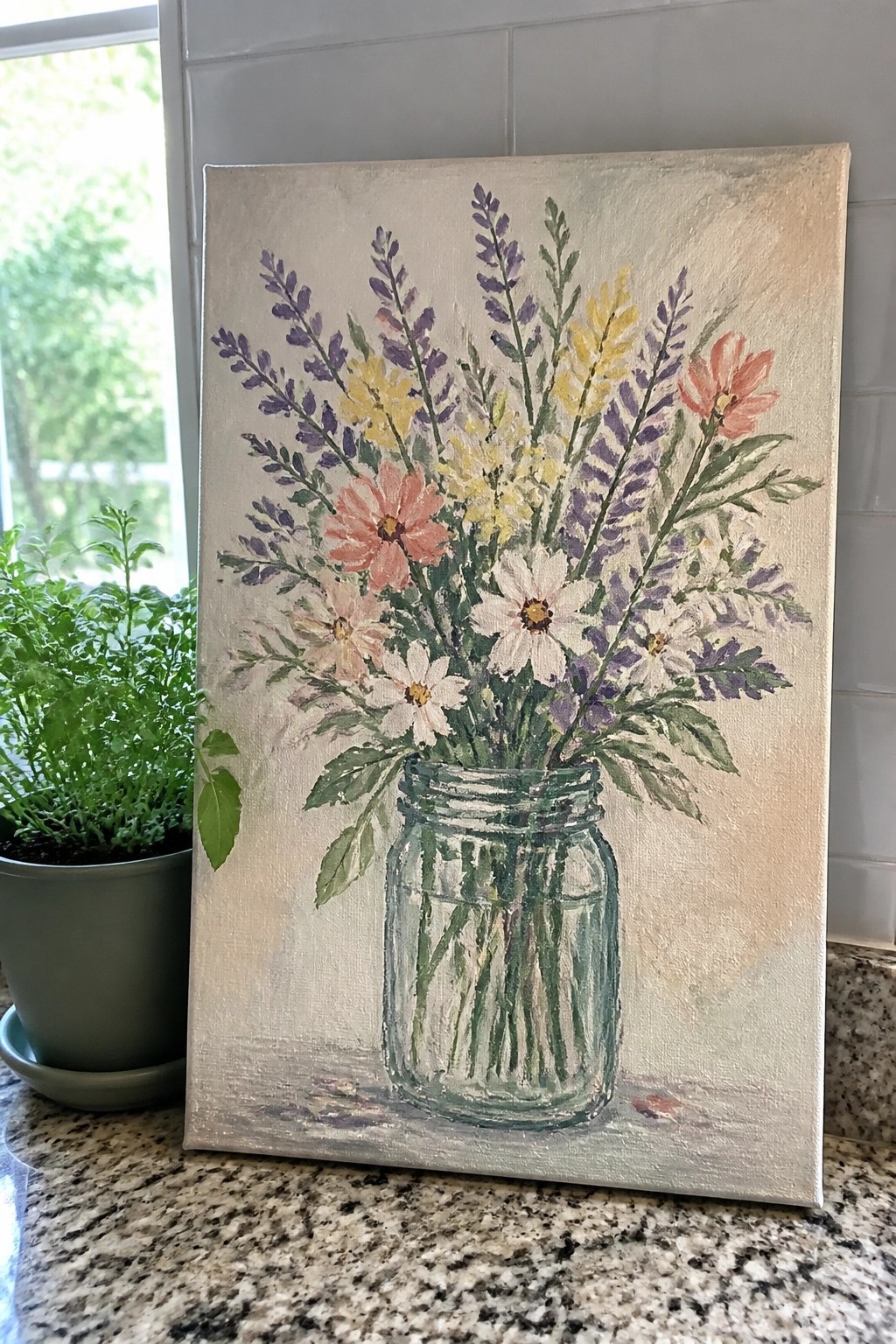Acrylic painting of colorful wildflowers in a green-tinted mason jar on a light canvas.