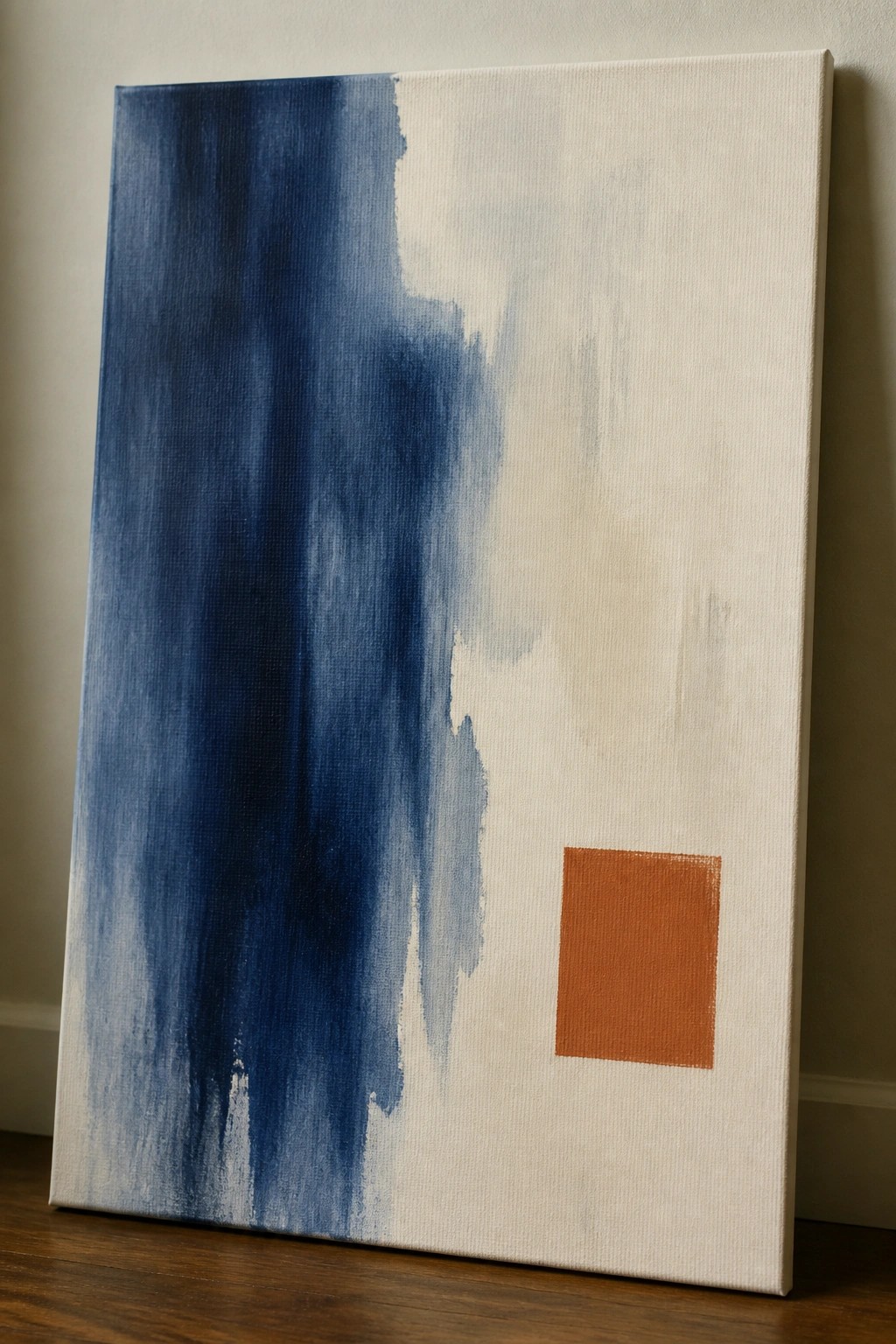 Abstract painting with blue vertical strokes and small orange square on right