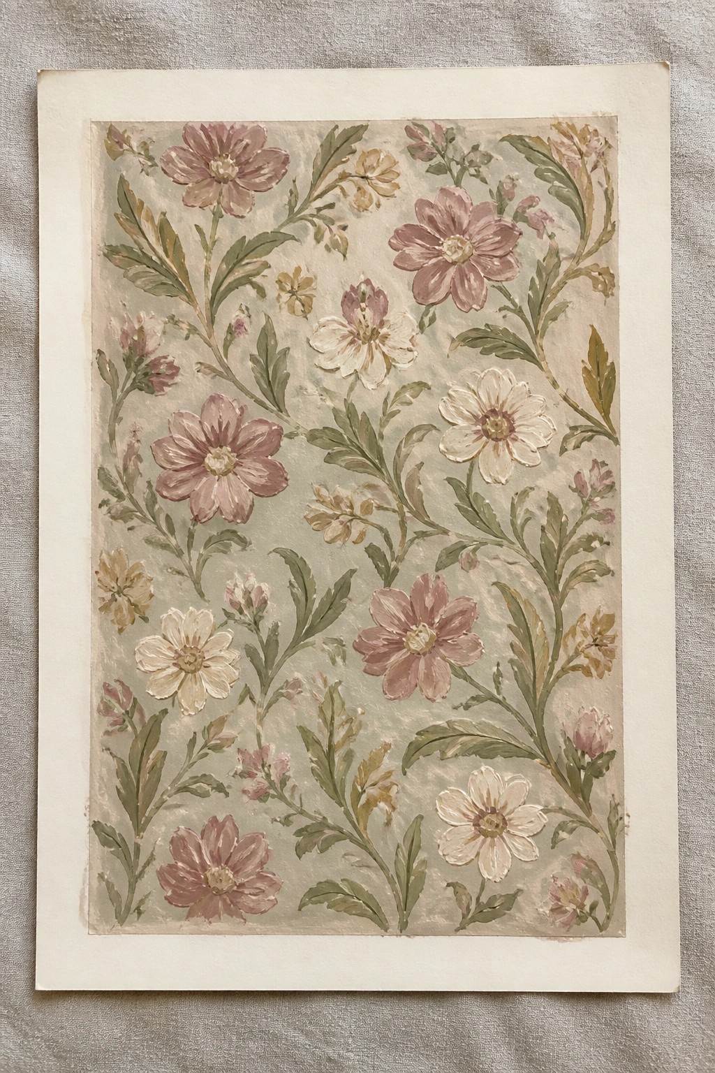 Watercolor floral pattern with pink white and yellow blooms on pale blue-green background