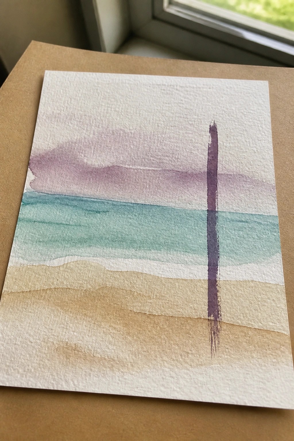Watercolor painting with purple sky wash, teal sea band, beige sand, and vertical purple stroke.