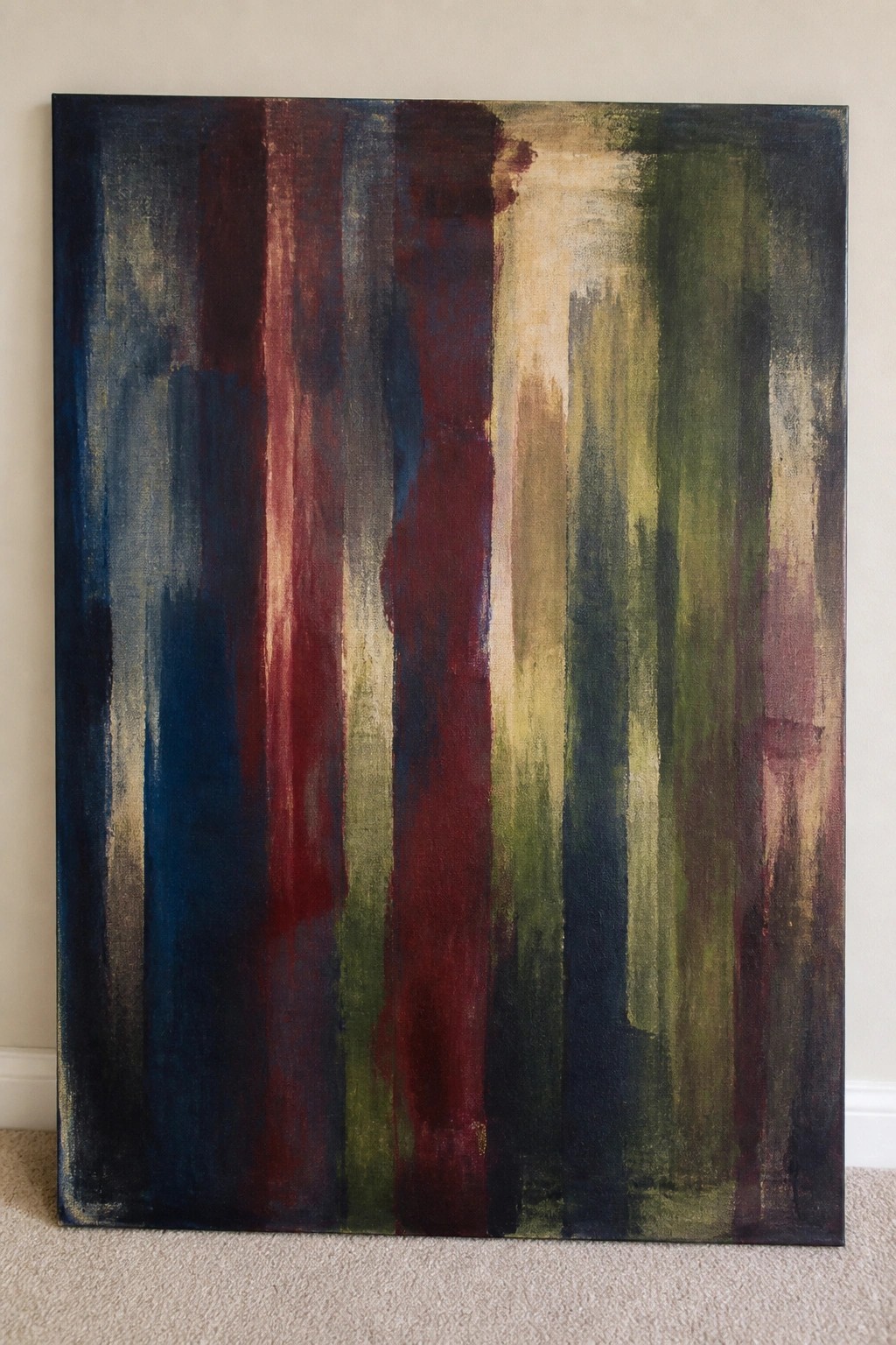 Abstract painting with vertical brushstrokes in dark blue, red, green, and beige tones