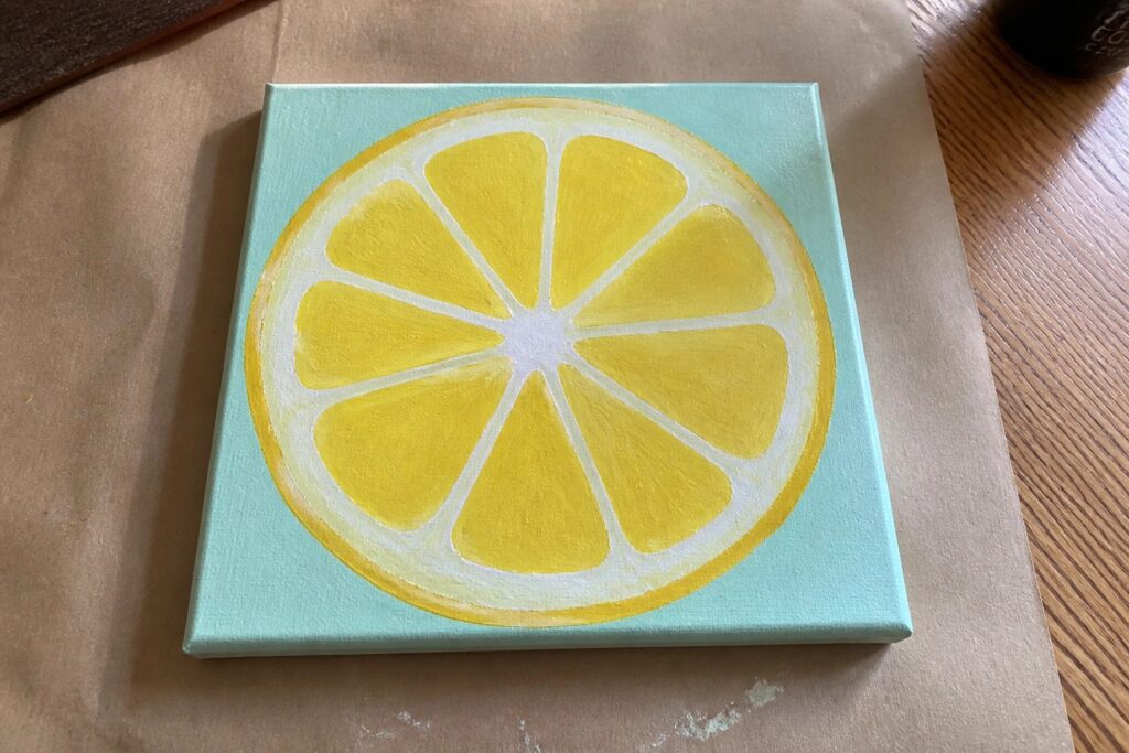 21 Quick Acrylic Painting Ideas For Fast And Satisfying Results Yellow lemon slice with white segments on square light turquoise canvas