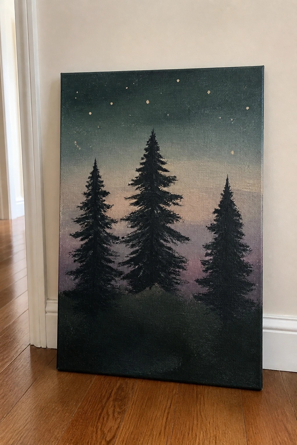Three silhouetted pine trees against a starry gradient night sky on canvas