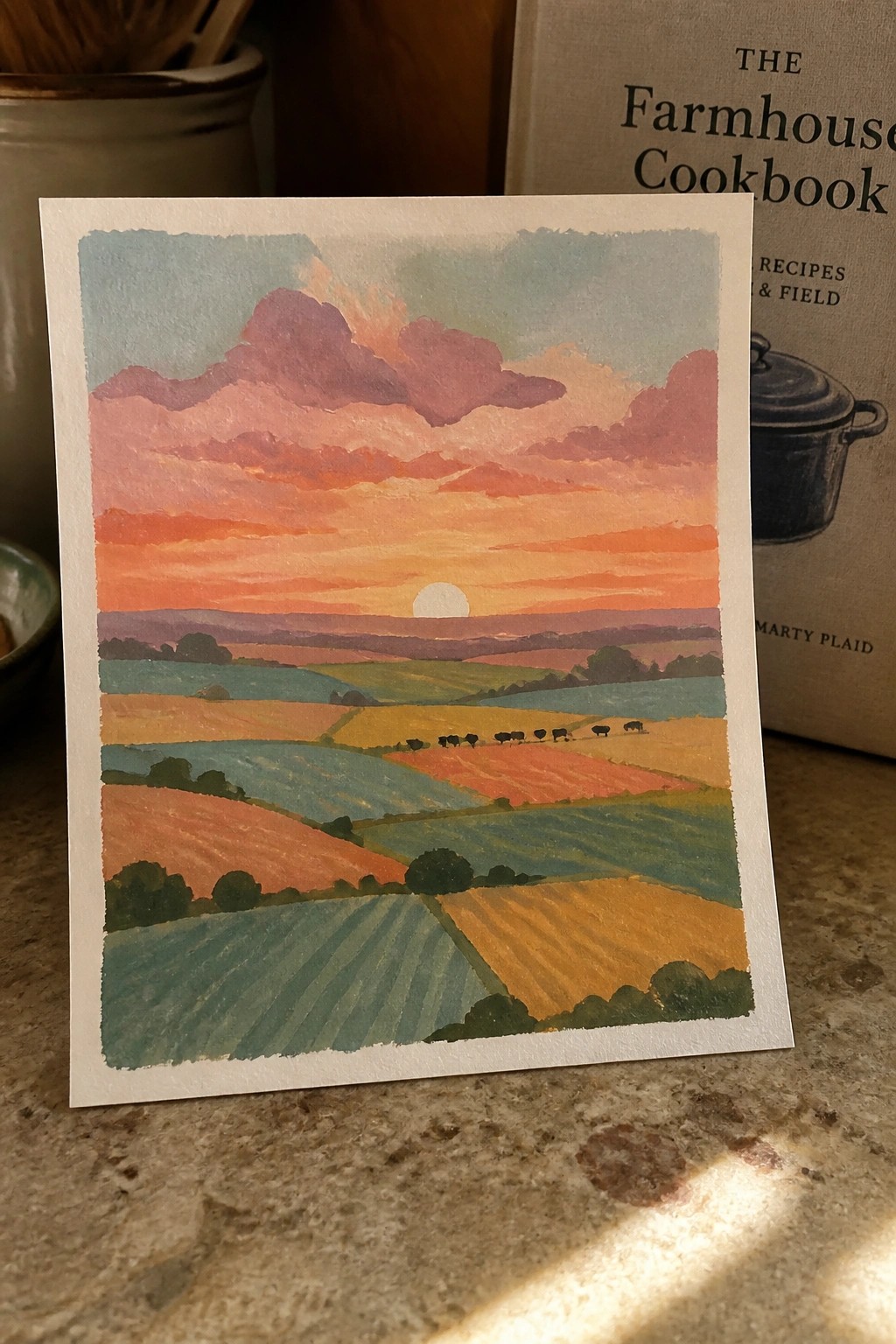 Watercolor painting of vibrant sunset over patchwork farmland fields and rolling hills