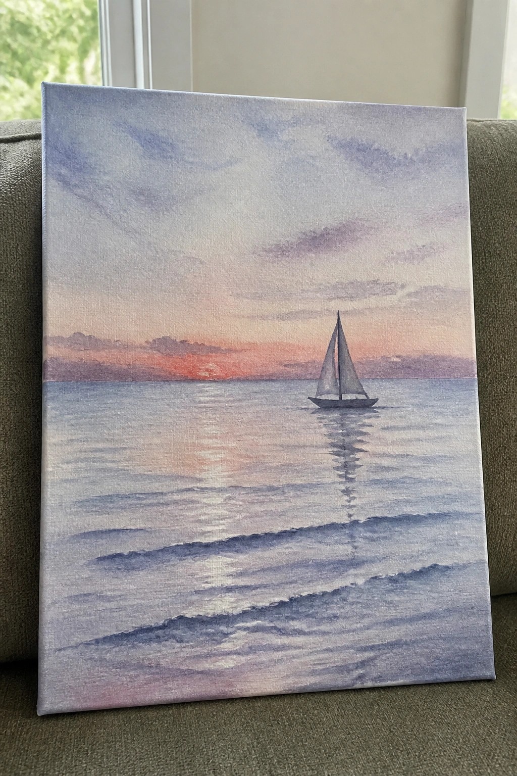 Canvas painting of lone sailboat on calm sea at vibrant sunset with reflection