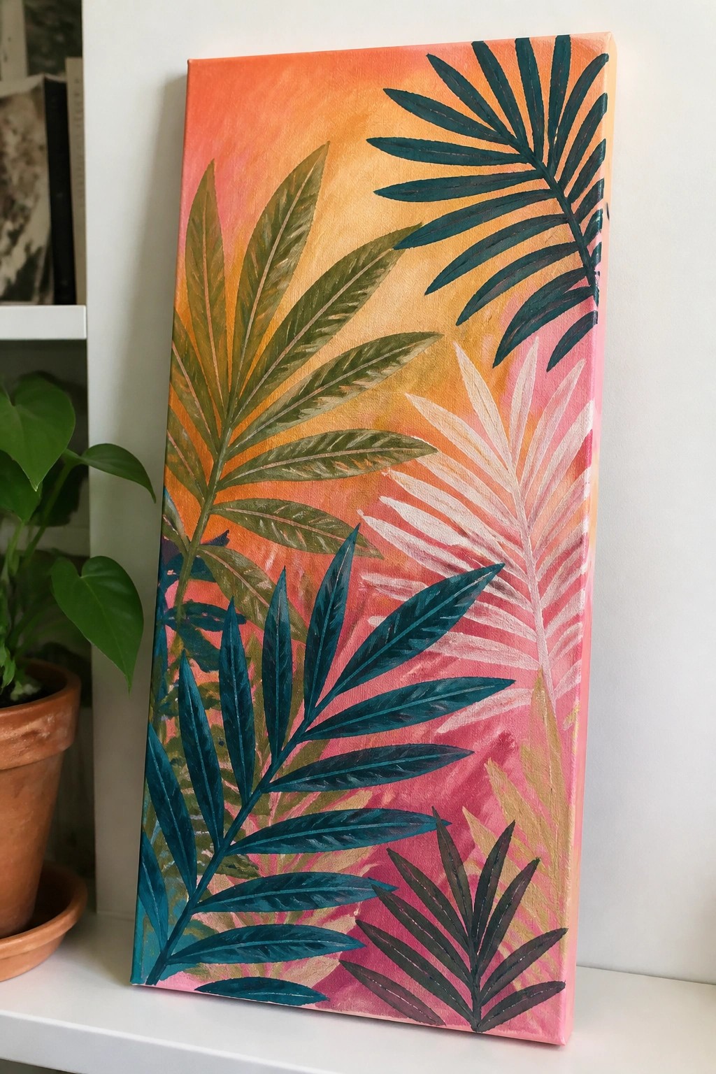 Vibrant tropical palm leaves on canvas with orange-pink gradient background.